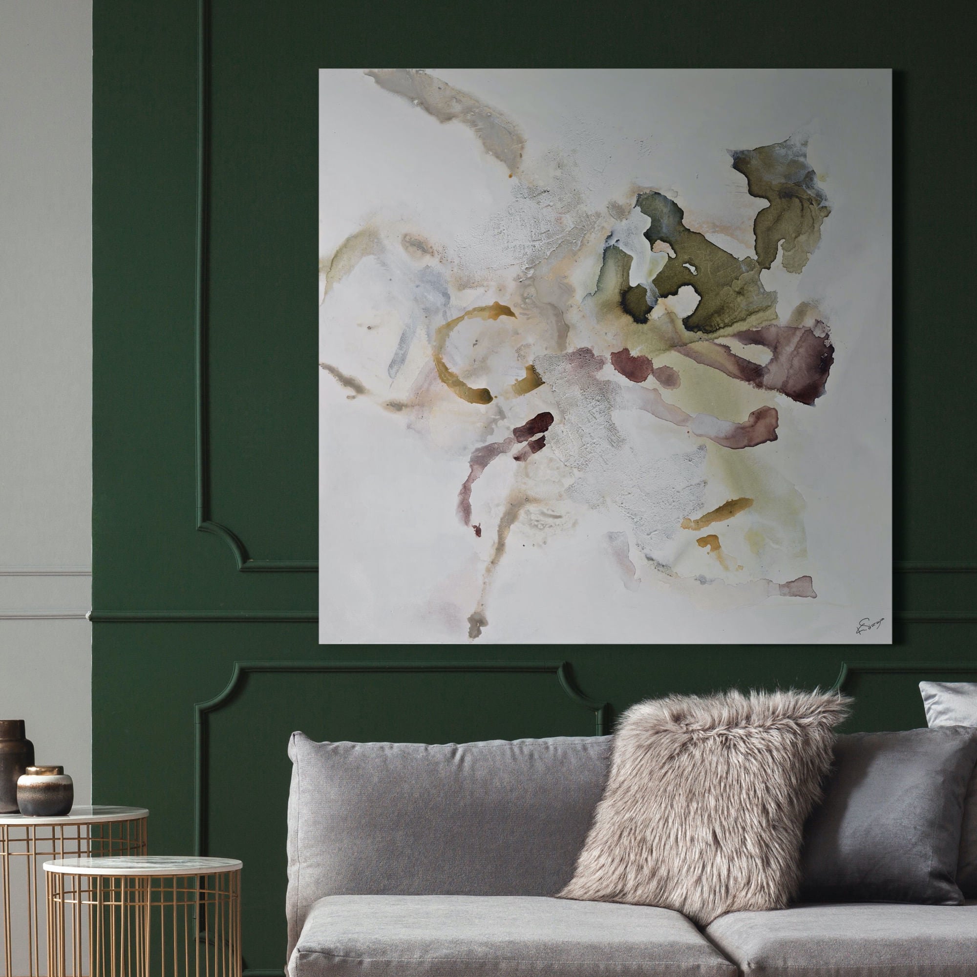 Topanga canvas art featuring abstract watercolor design in muted greens, browns, and whites, displayed on a dark green wall.