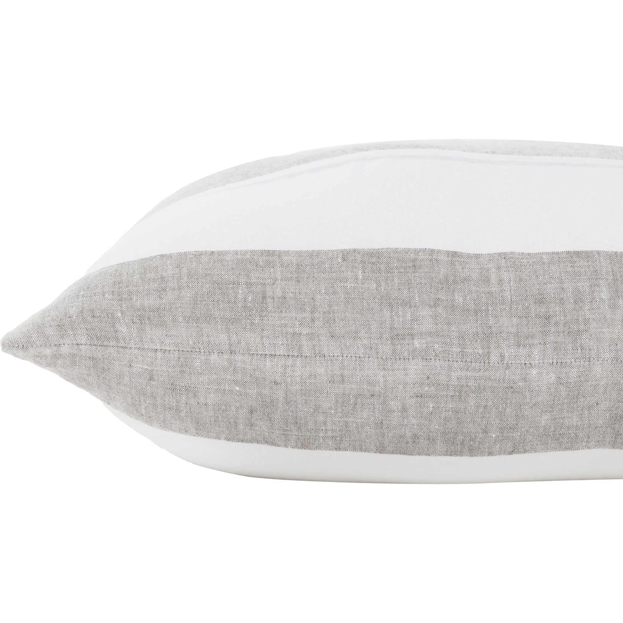 Cassidy pillow featuring a white top and a textured light gray linen bottom, viewed from the side.