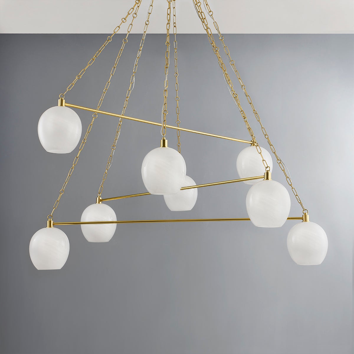 Asbury Park Chandelier 54.5" in aged brass shown from a second angle to highlight the frame, arms, and shade detail.