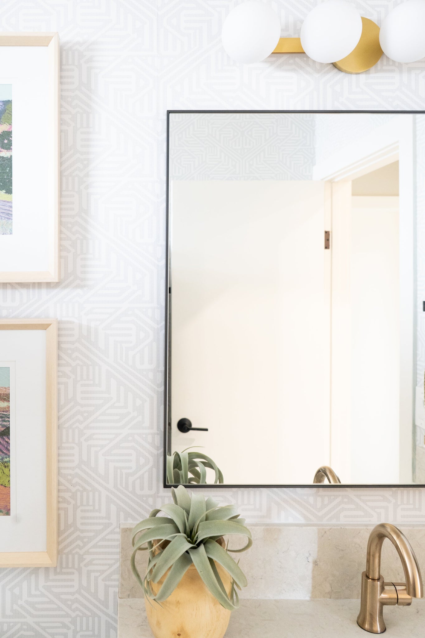Baird Bath And Vanity 23.5" in aged brass styled in a primary ensuite for warm, layered light at Laurie Yapp Home.
