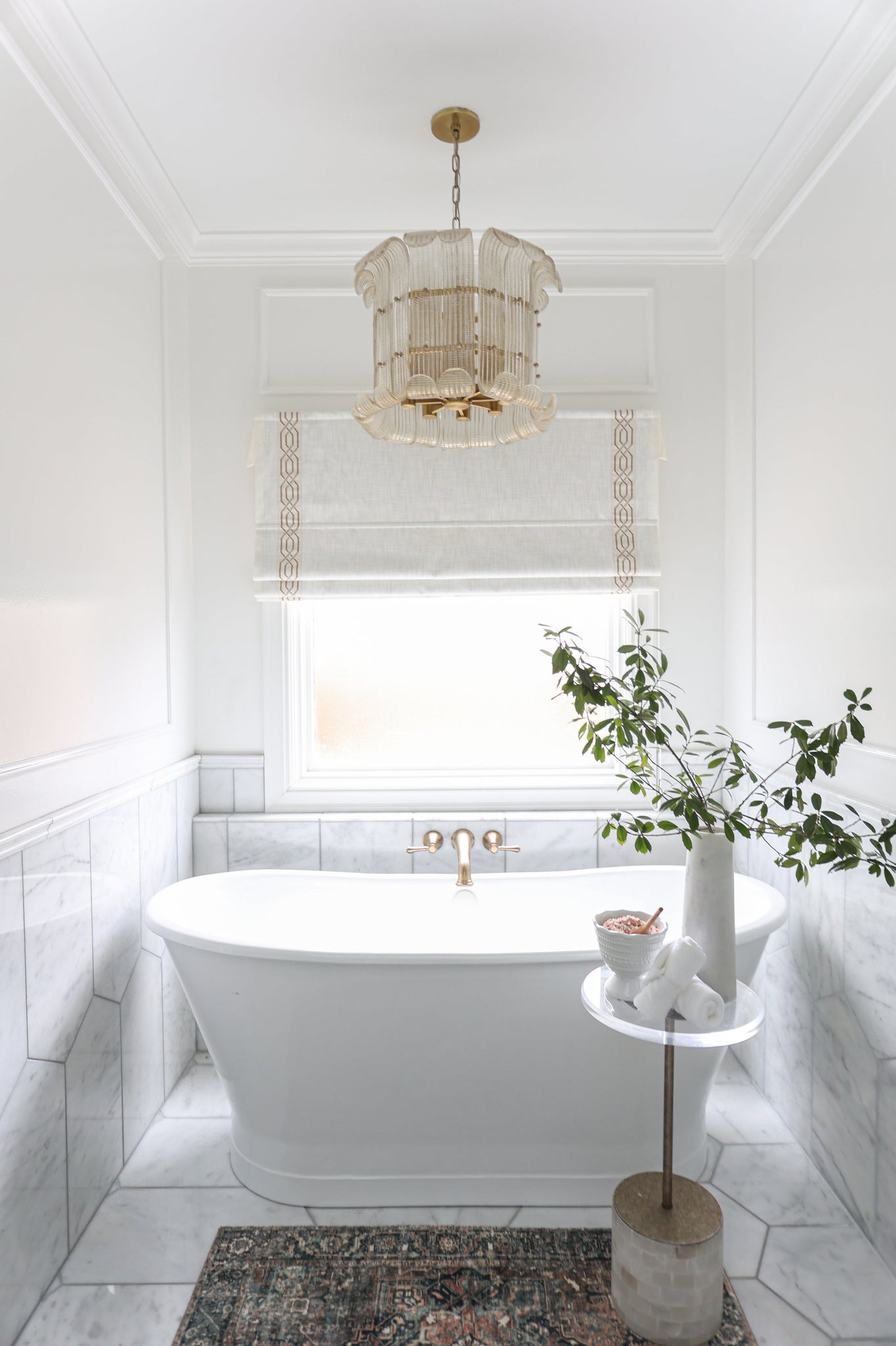 Brasher Chandelier in aged brass styled in a formal living room for warm, layered light at Laurie Yapp Home.