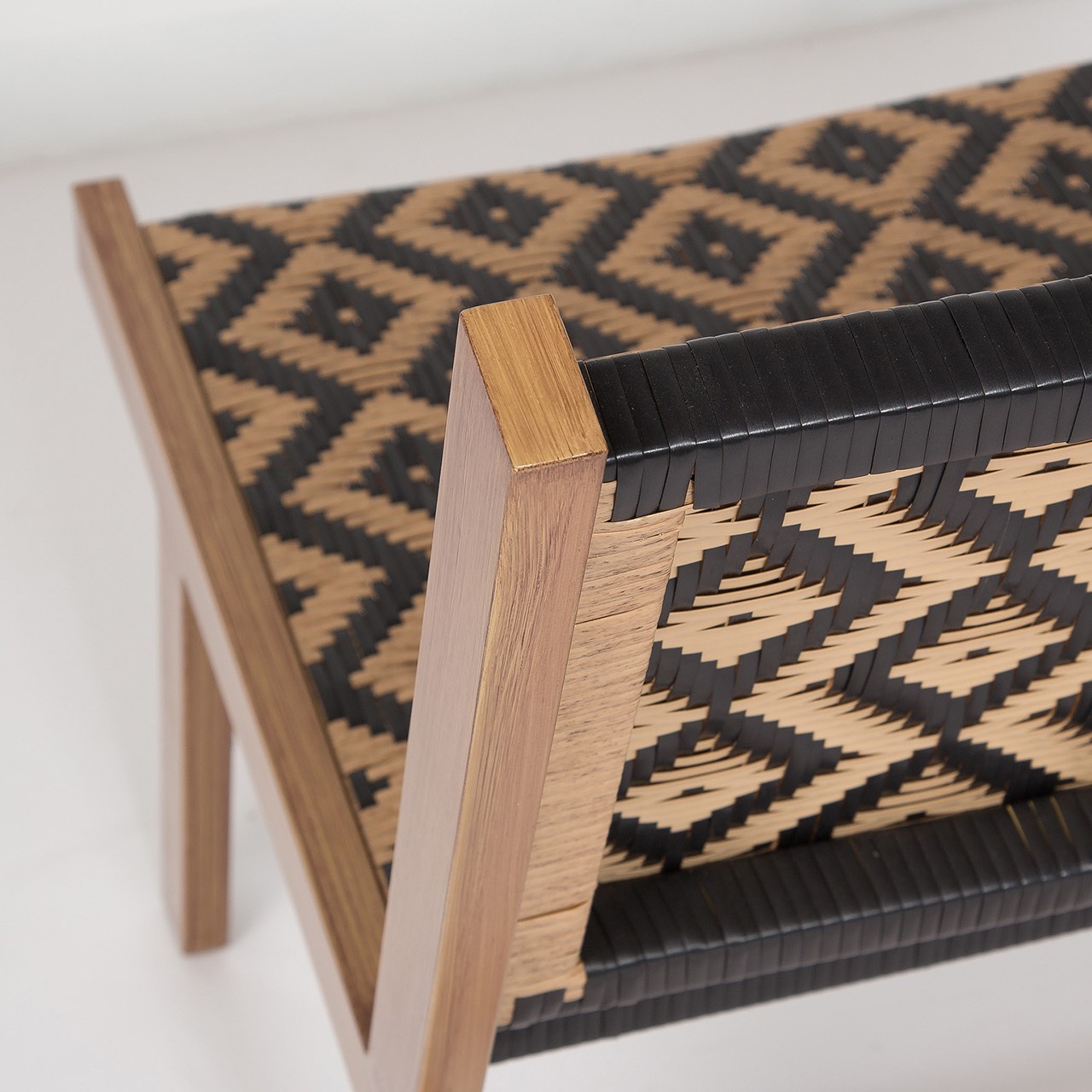 Wooden stool with a geometric pattern on a white background
