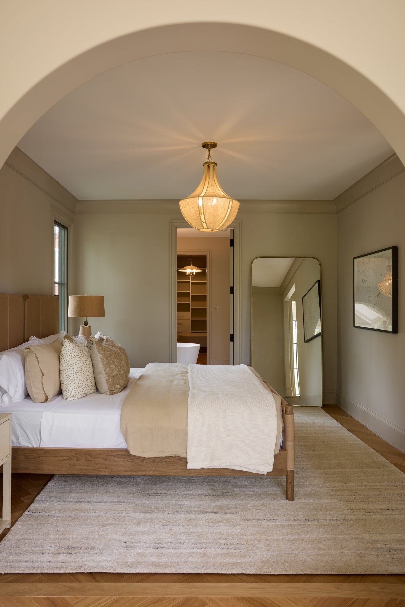 Cascade Lake Pendant 20" in aged brass styled in a bright kitchen for warm, layered light at Laurie Yapp Home.