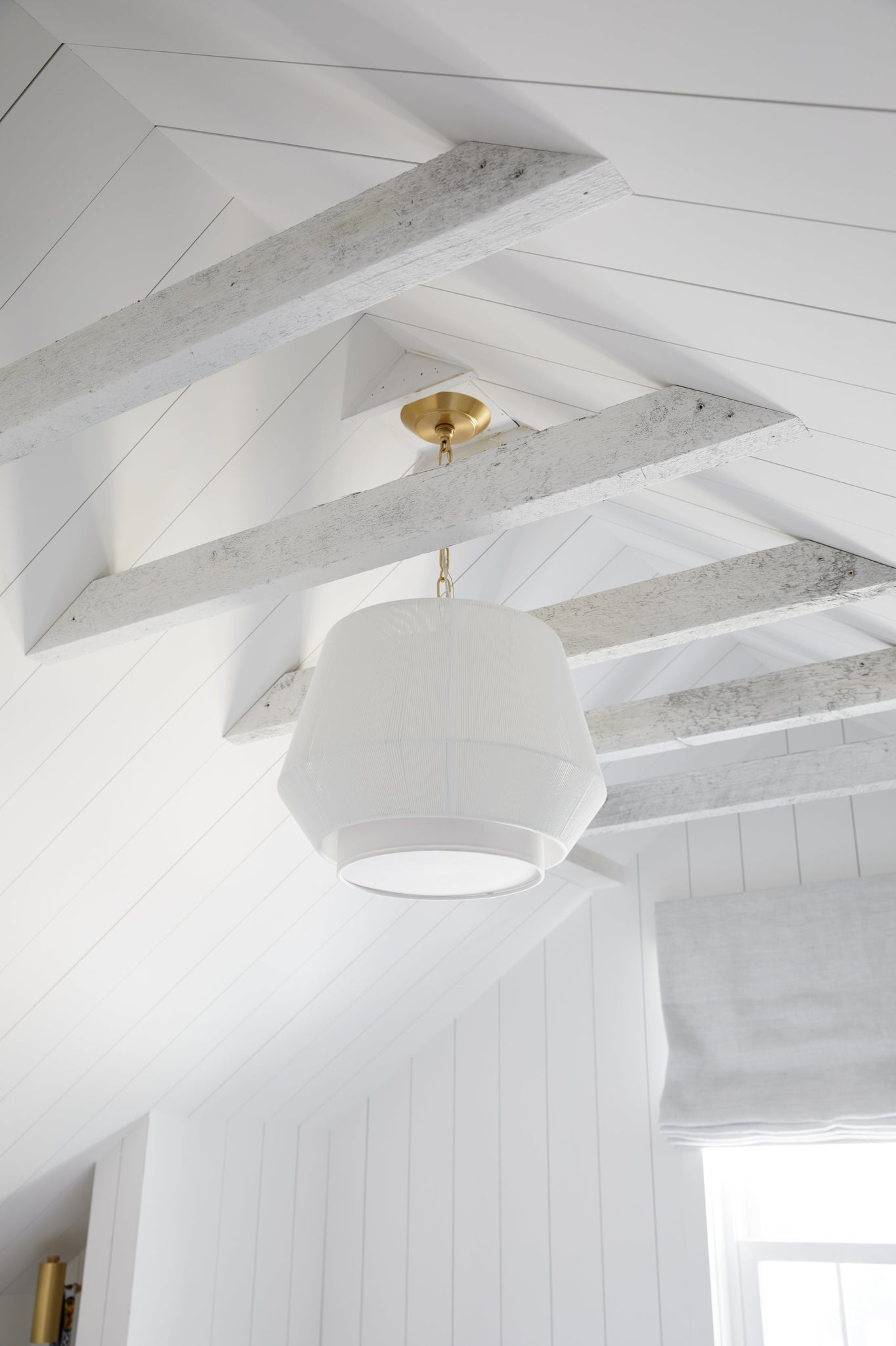 Debi Pendant 18" in aged brass styled in an elegant dining room for warm, layered light at Laurie Yapp Home.