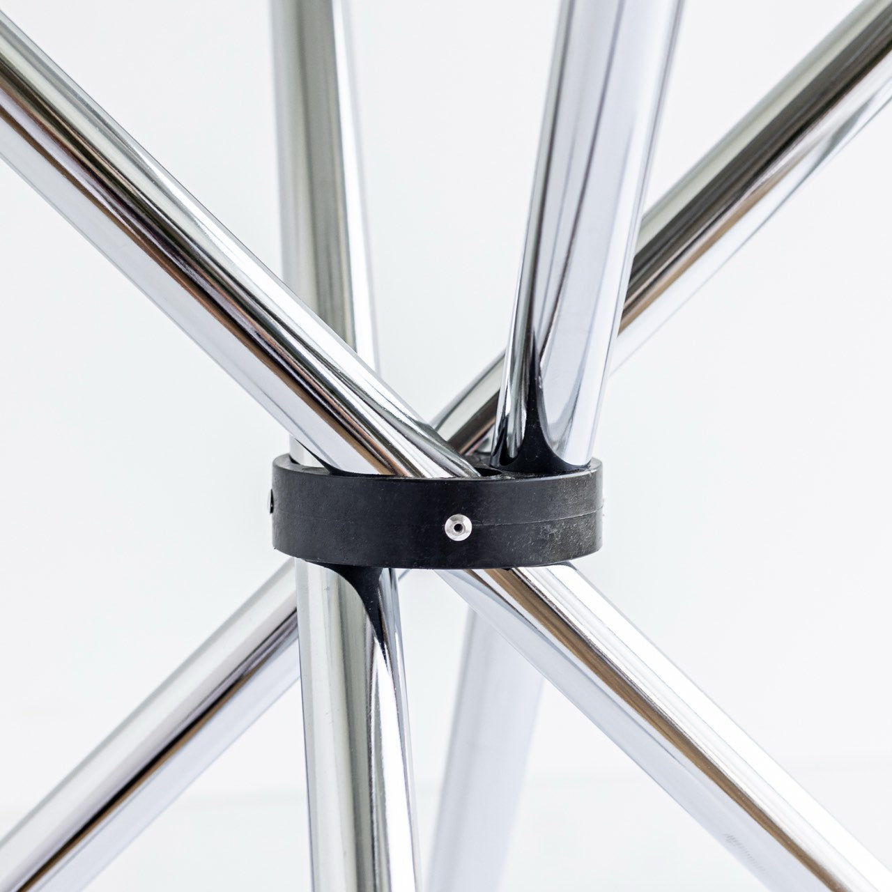 Close-up of a bicycle wheel with a black tire band on a white background
