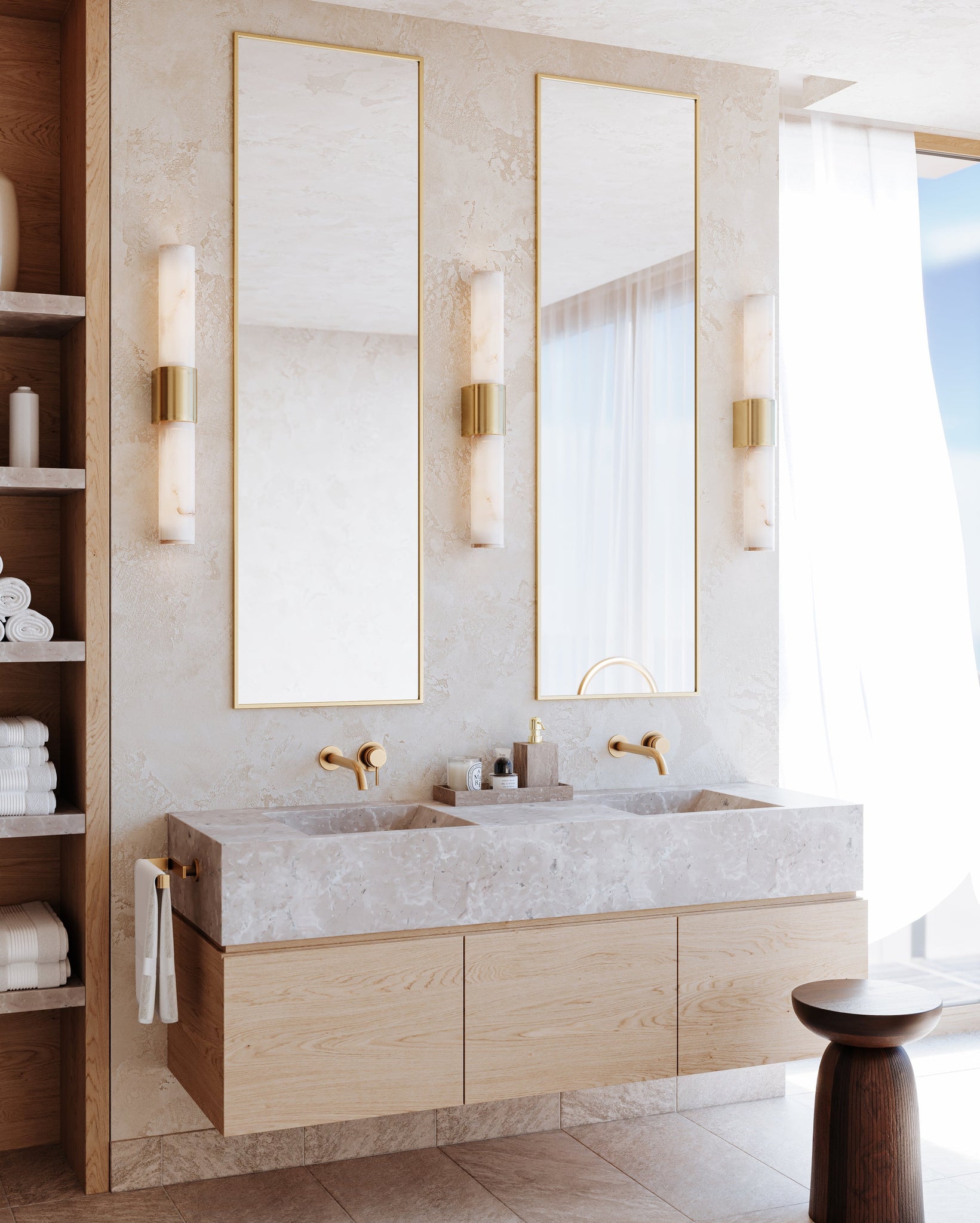 Ellington Bath And Vanity 3.25" x 14" in aged brass shown from the front to reveal the arm spread and shade silhouette.