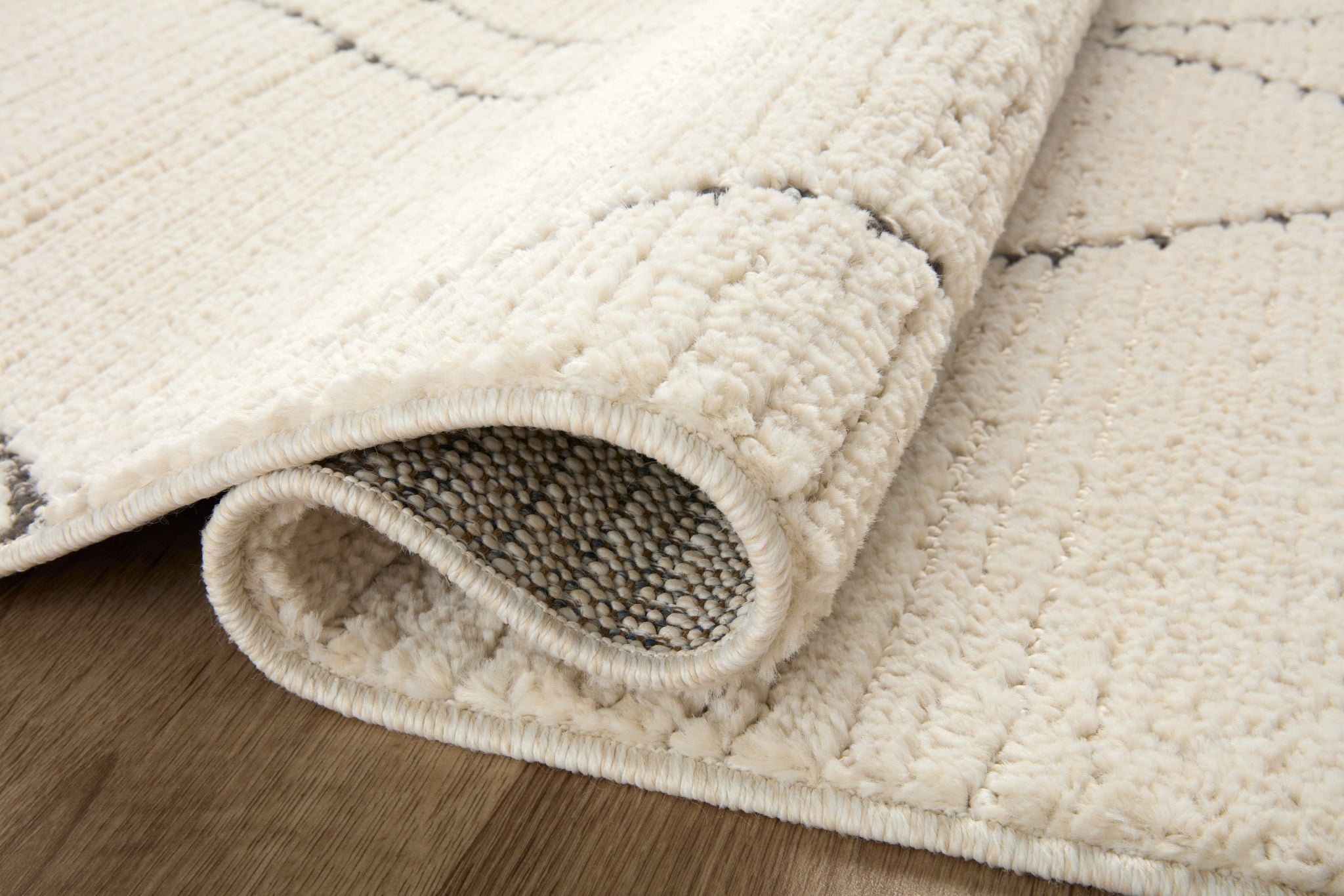 detail view of Fabian Ivory / Charcoal luxury Rug