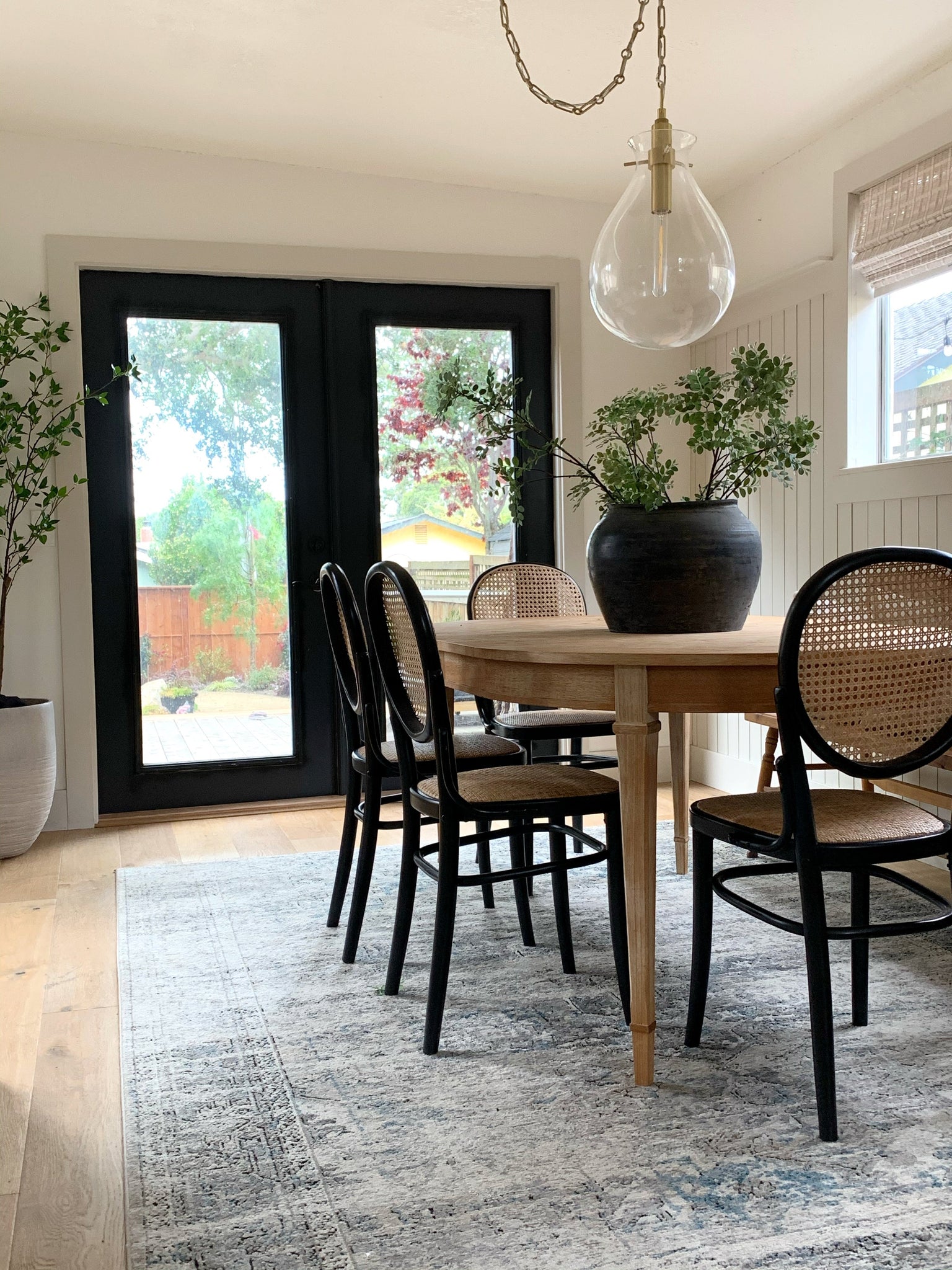 Ivy Pendant 18" in aged brass styled in a welcoming entryway for warm, layered light at Laurie Yapp Home.