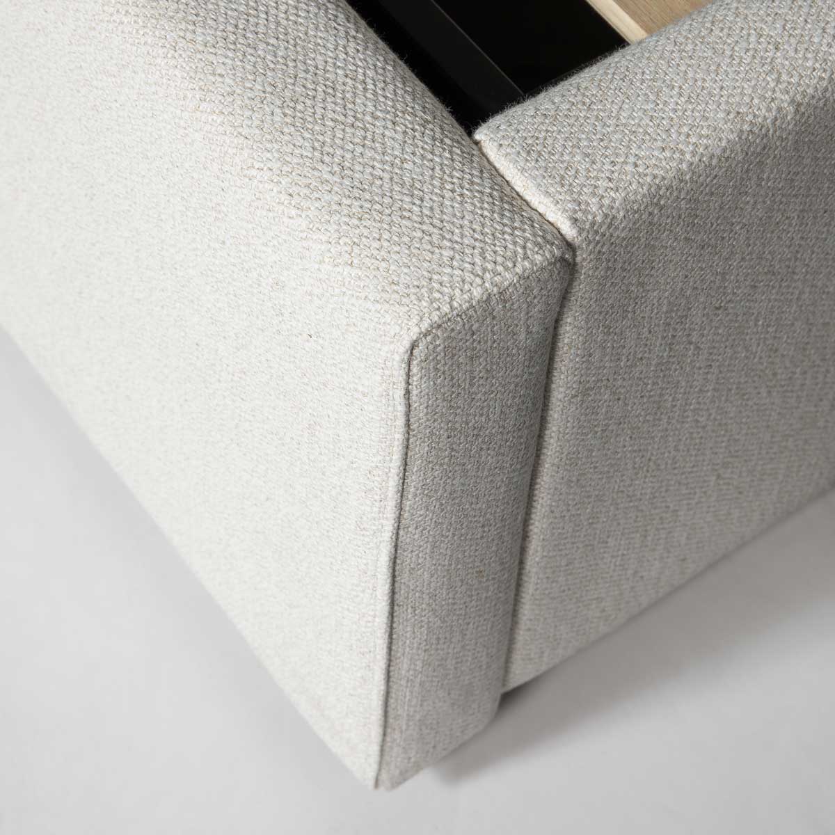 Close-up of a textured gray fabric corner on a white background