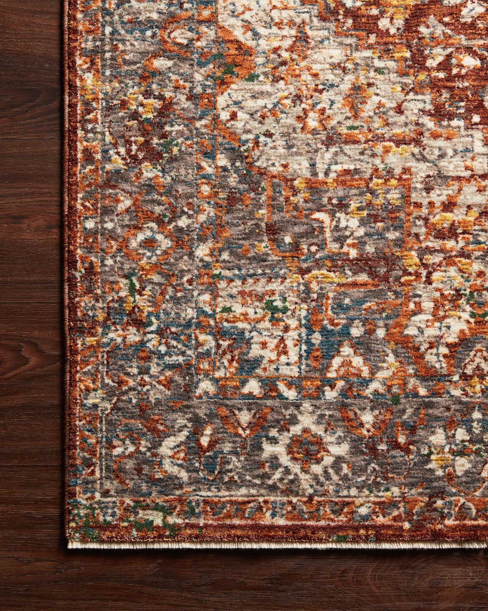 side view of Lourdes Rust / Multi luxury Rug