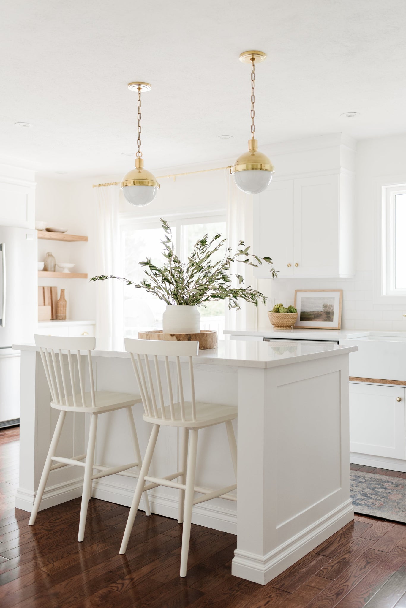 Lambert Pendant 9.5" in aged brass styled in a bright kitchen for warm, layered light at Laurie Yapp Home.