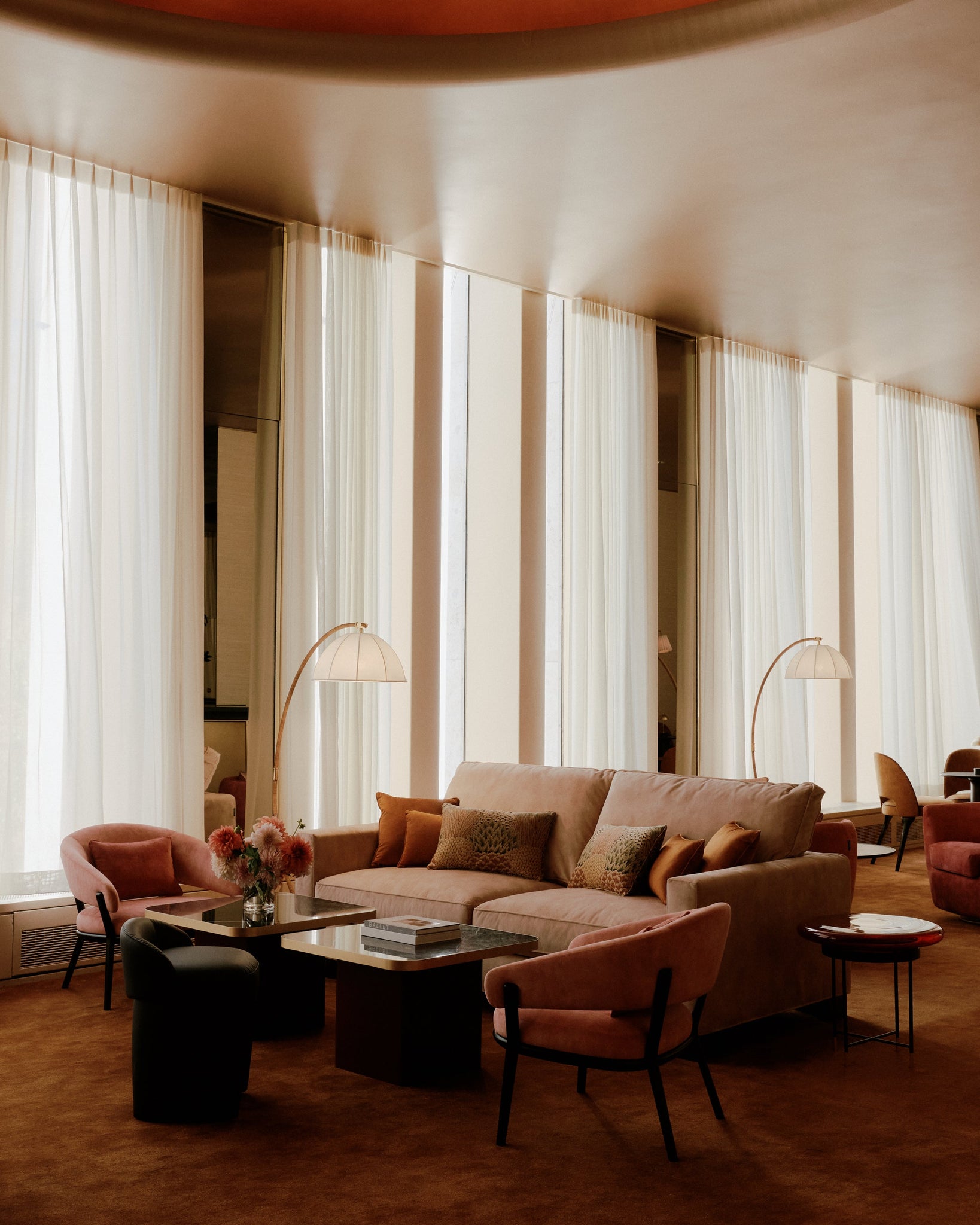 Montague Floor Lamp in aged brass styled in a reading nook for warm, layered light at Laurie Yapp Home.