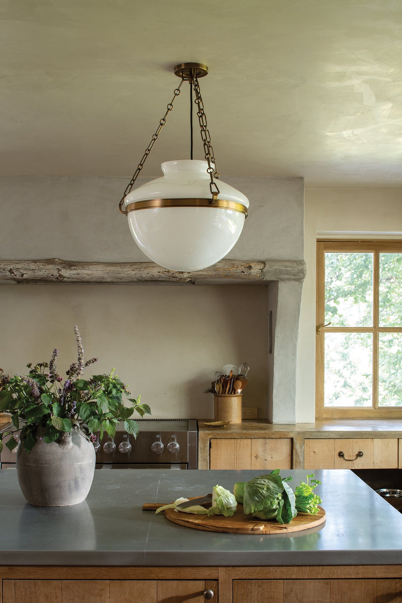 Paradigm Pendant 19" styled in an elegant dining room for warm, layered light at Laurie Yapp Home.