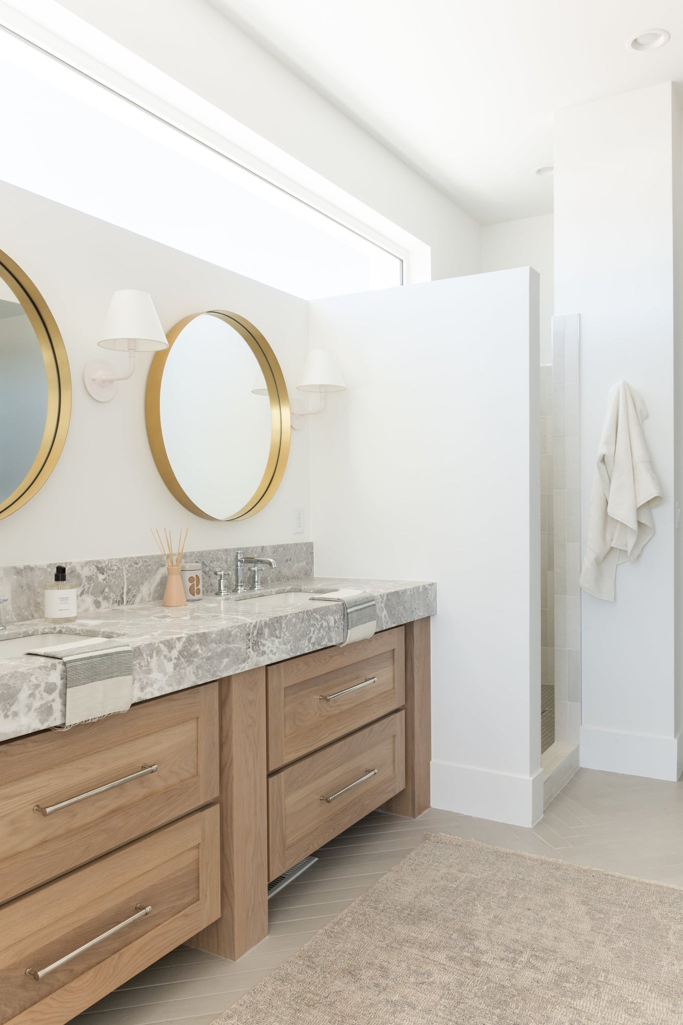 Signature No.1 Wall Sconce 8" x 11.25" in White styled in a curated living room for warm, layered light at Laurie Yapp Home.