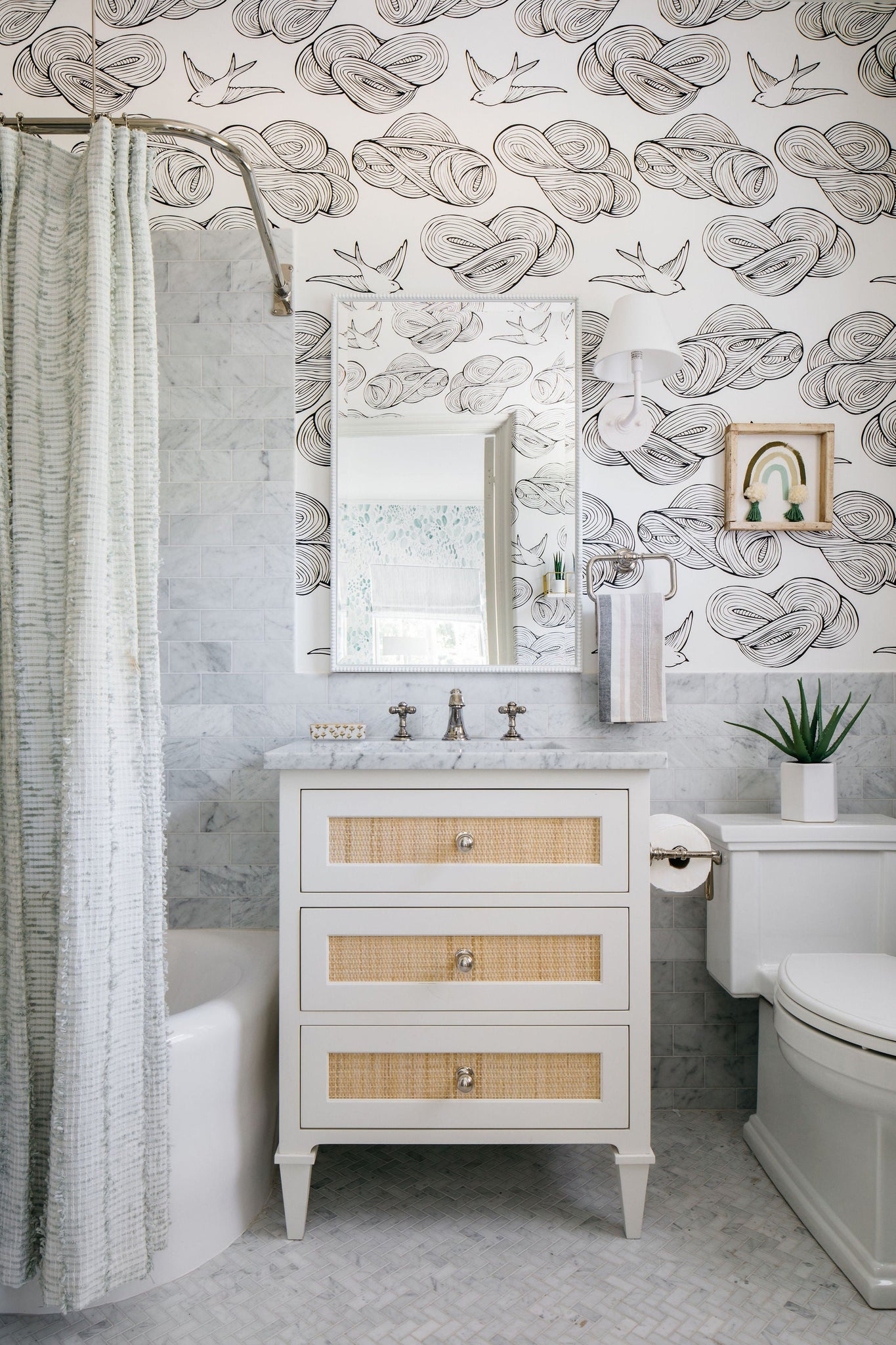 Signature No.1 Wall Sconce 8" x 11.25" in White styled in a modern bathroom for warm, layered light at Laurie Yapp Home.