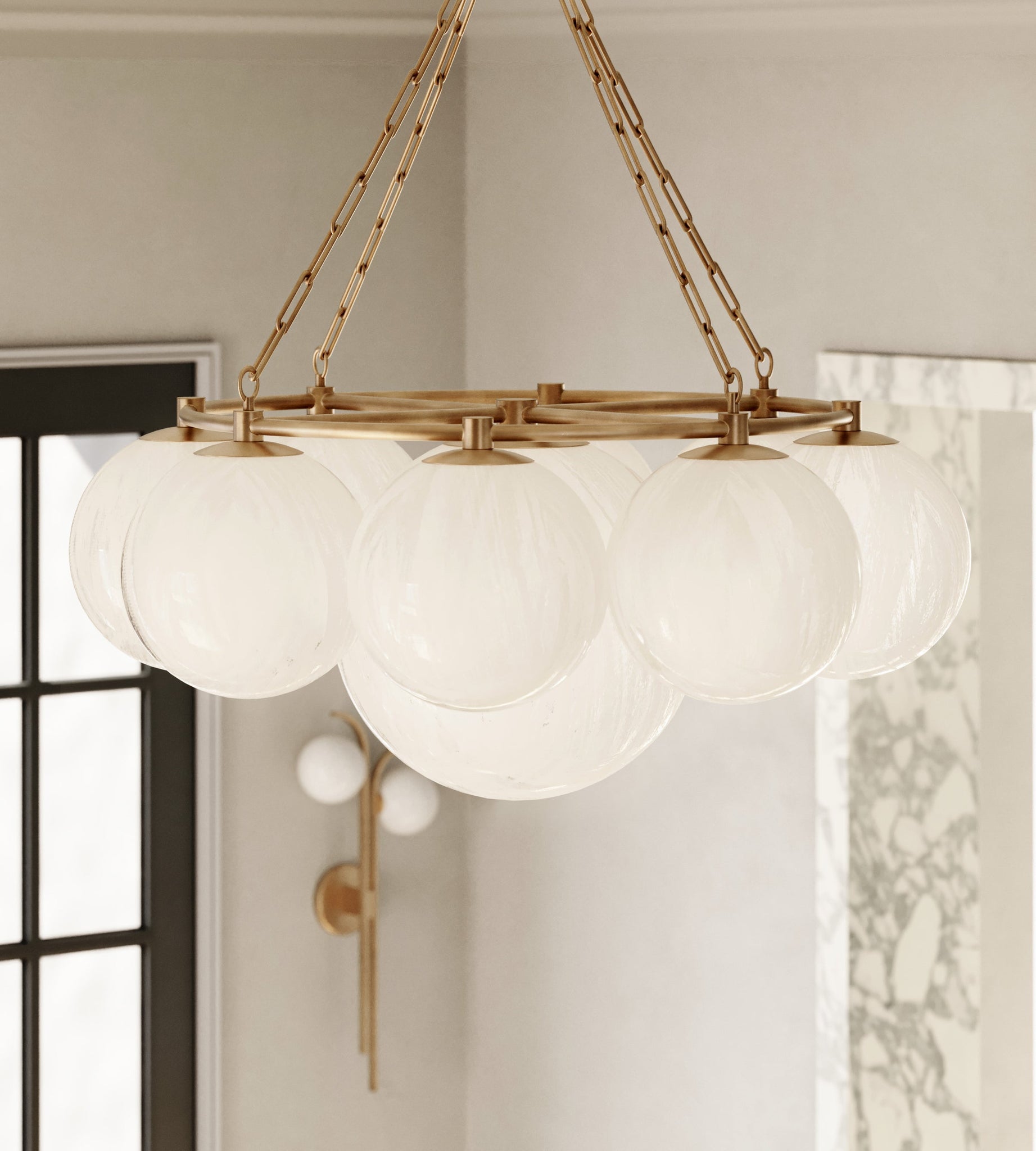 Close-up of the Laval Wall Sconce 10.5" in aged brass showing the arm curve and shade silhouette.