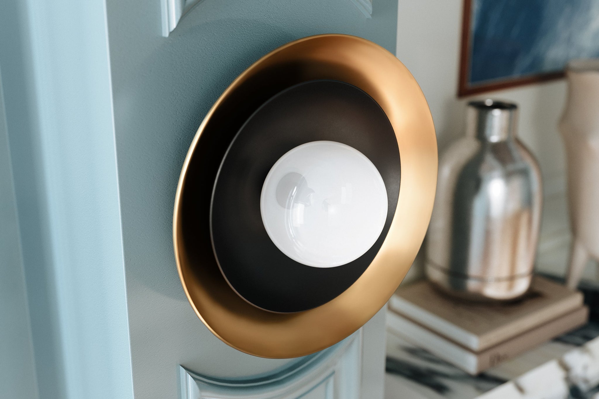 Tobia Wall Sconce shown from the front to reveal the arm curve and shade silhouette.