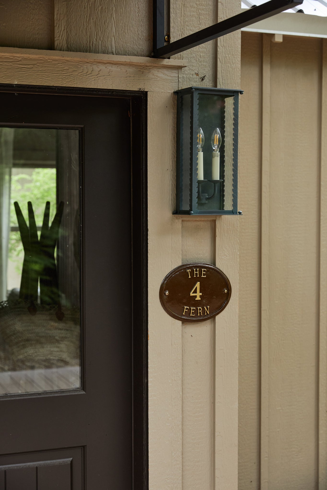 Zuma Exterior Wall Sconce 7.75" styled in a modern bathroom for warm, layered light at Laurie Yapp Home.