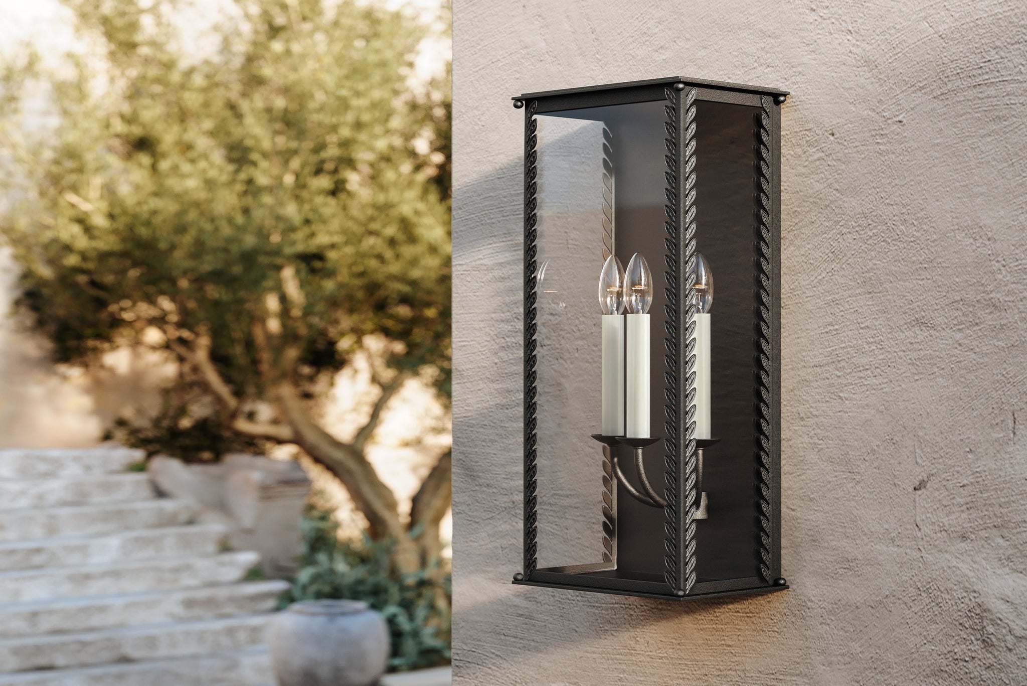 Zuma Exterior Wall Sconce 9.5" styled in a curated living room for warm, layered light at Laurie Yapp Home.