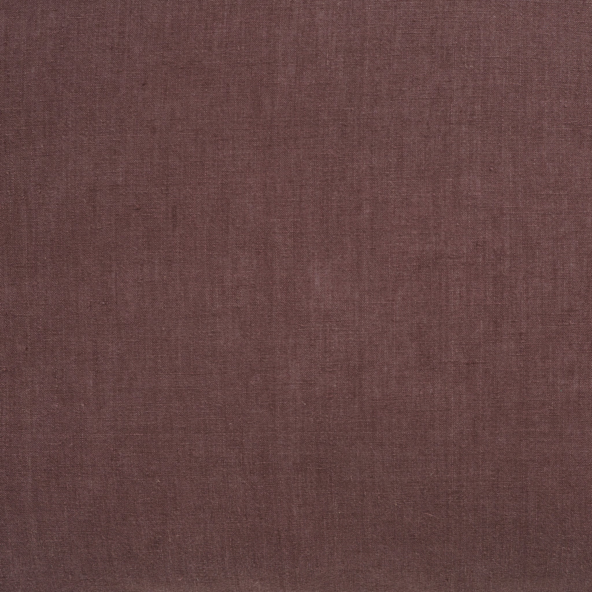 Close-up of Pan Indoor Pillow fabric in brown, highlighting its soft texture.