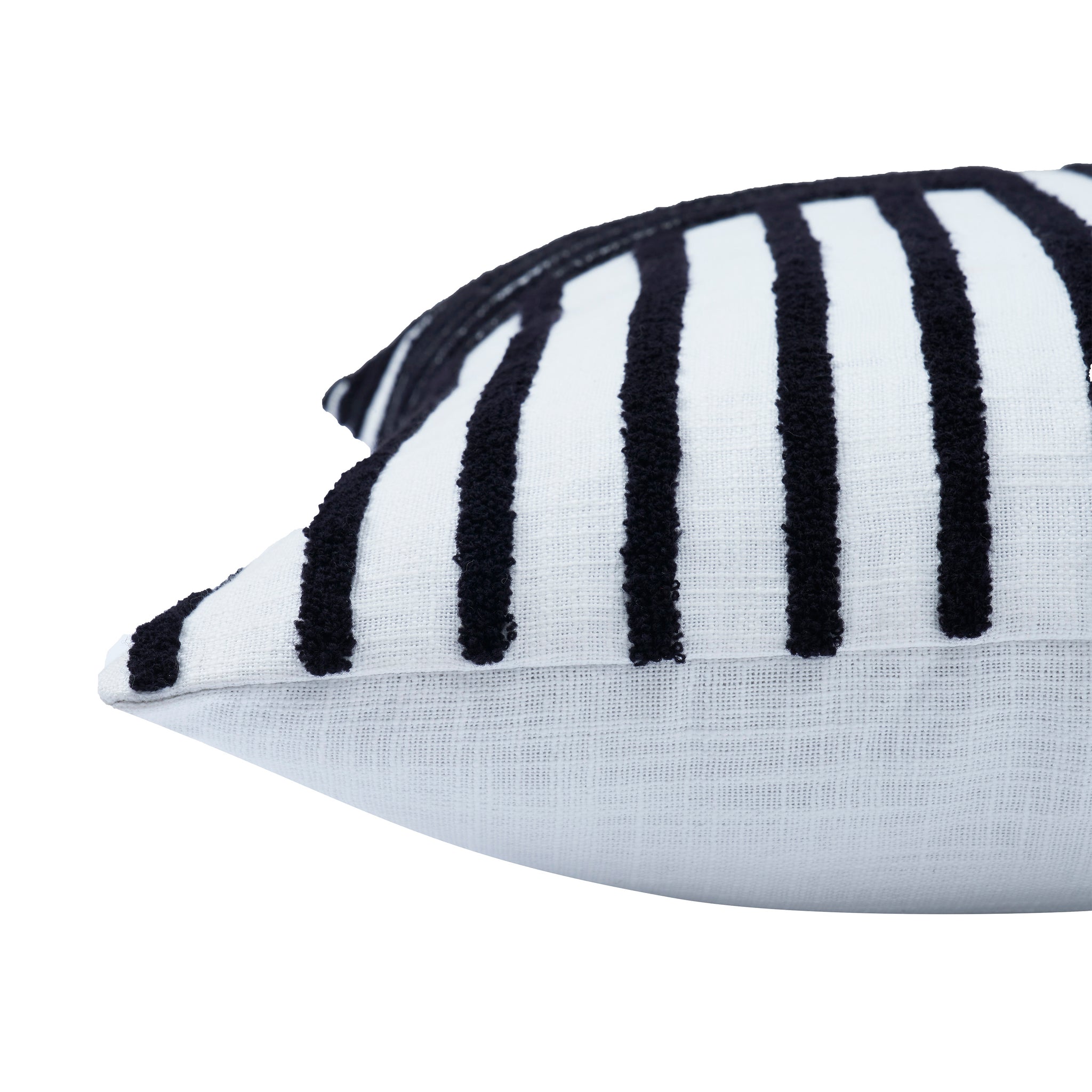 Detailed side view of Stilo indoor pillow highlighting its textured black and white stripes.