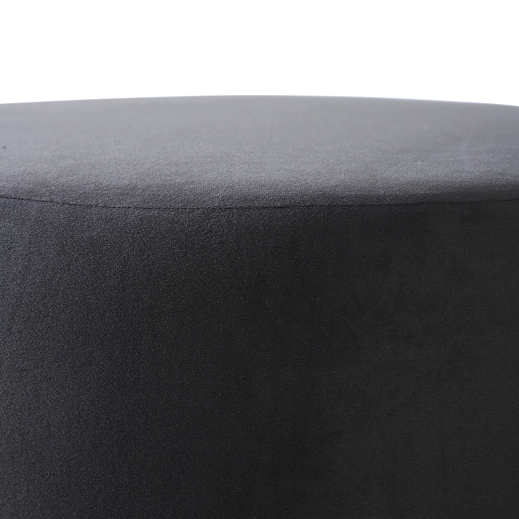 Colum Ottoman in dark gray velvet, close-up of the top surface, smooth texture.