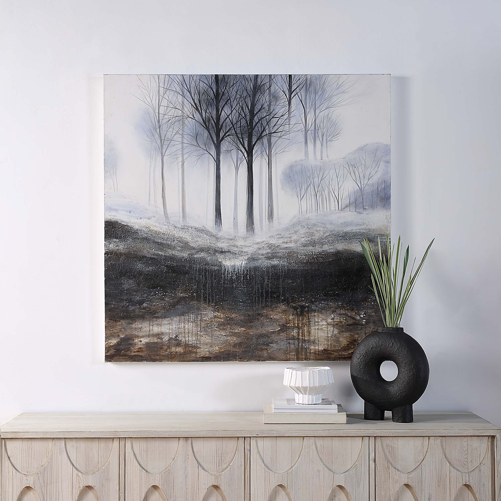 Rainier Canvas Art displayed on a wall above a wooden console with decorative items.