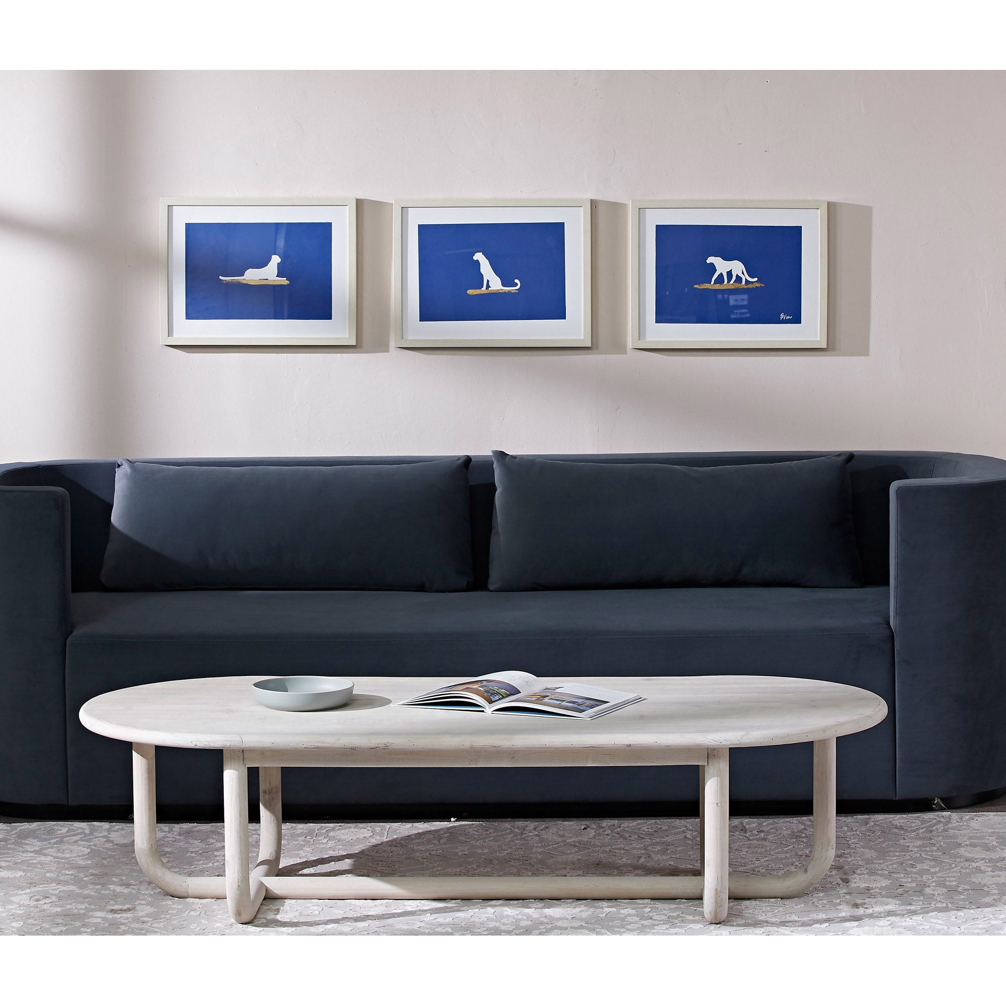 Makalu Wall Art displayed above a dark sofa in a modern living room setting