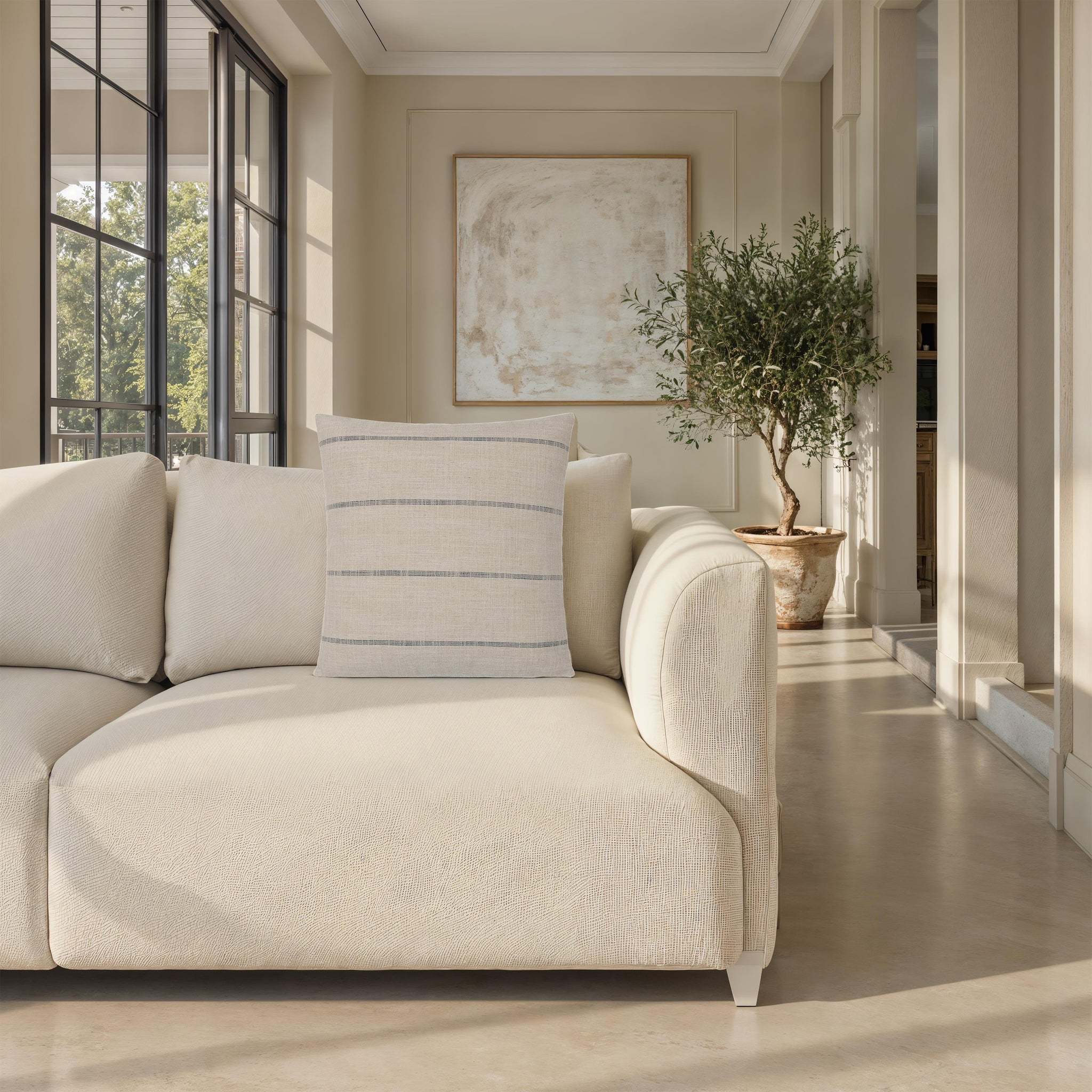 Montana indoor pillow on a light sofa in a well-lit living room