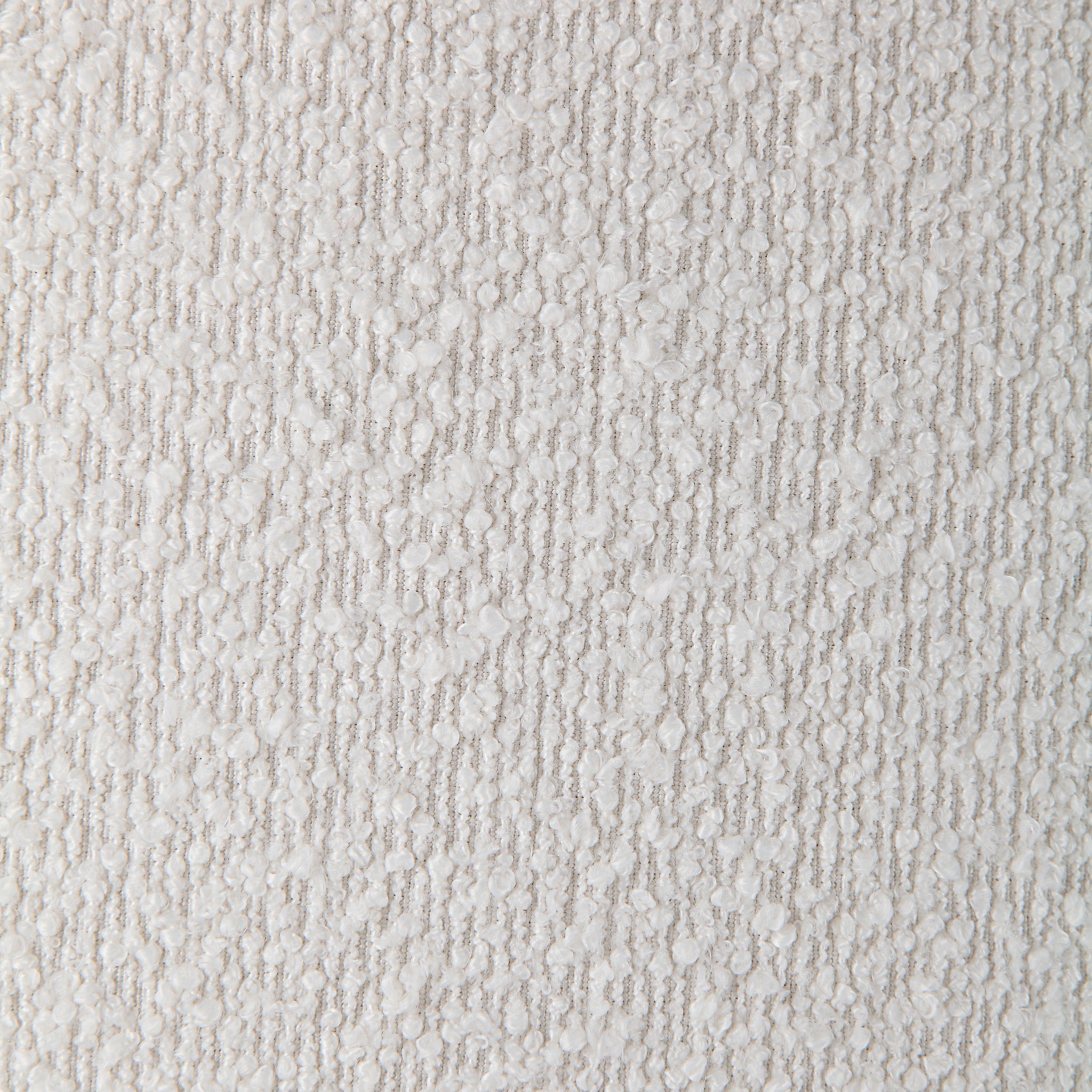 Close-up of Audrina Ottoman's textured white fabric, showcasing intricate details