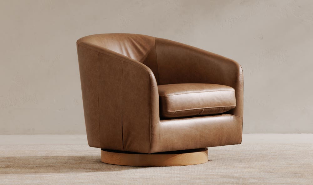 angle view of Oscy Leather Swivel luxury Chair