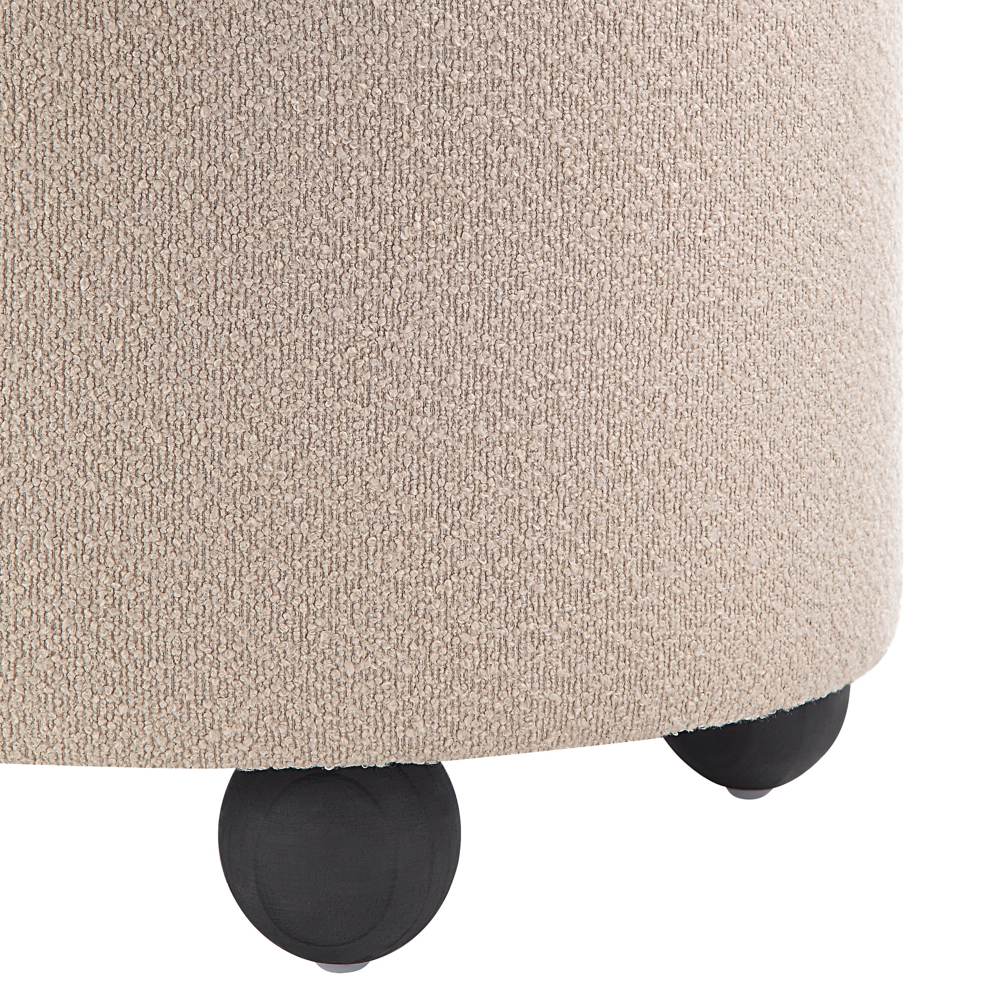 Beige Claude Ottoman with a plush surface and black rounded legs