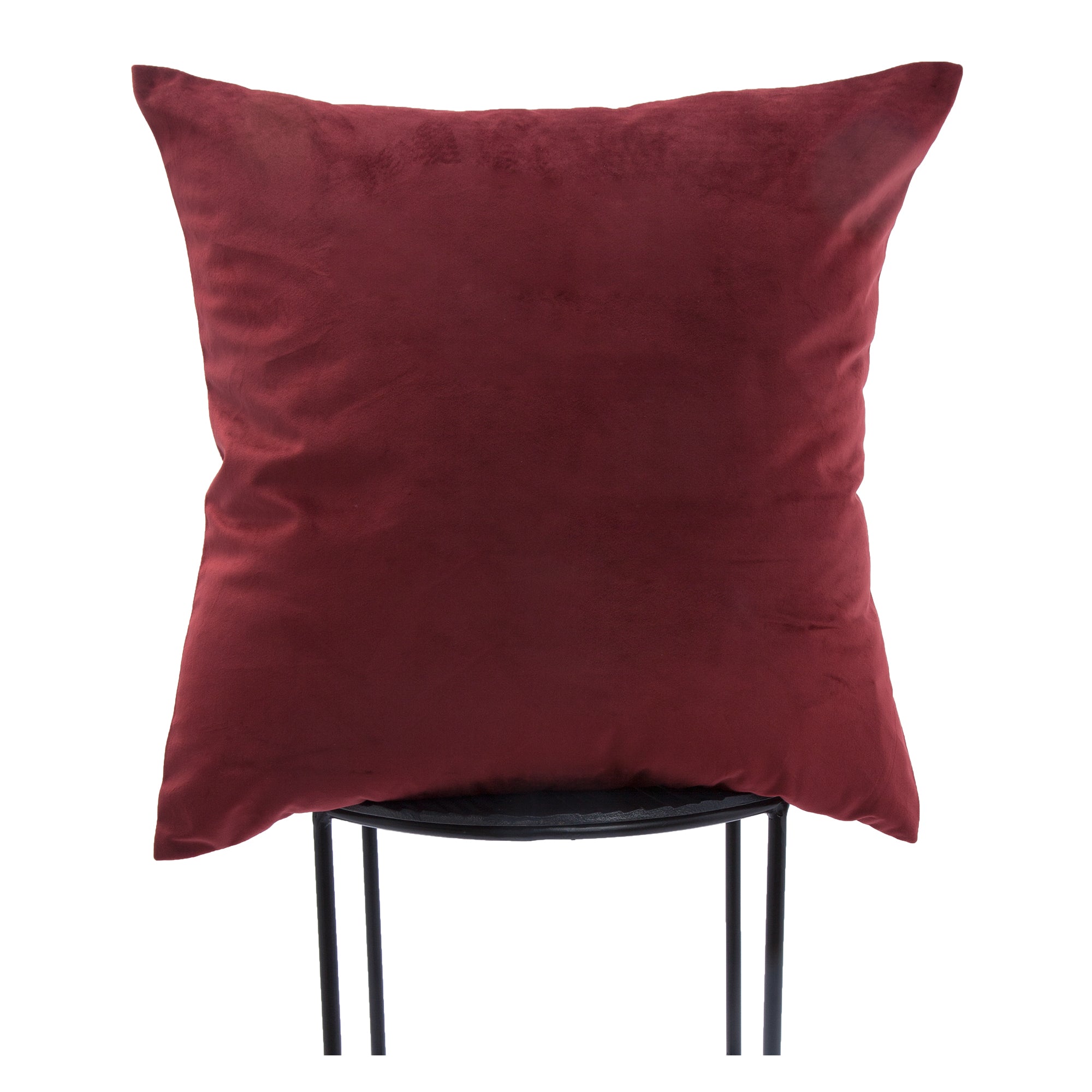 Scarlet pillow in deep red, displayed upright on a black metal chair.