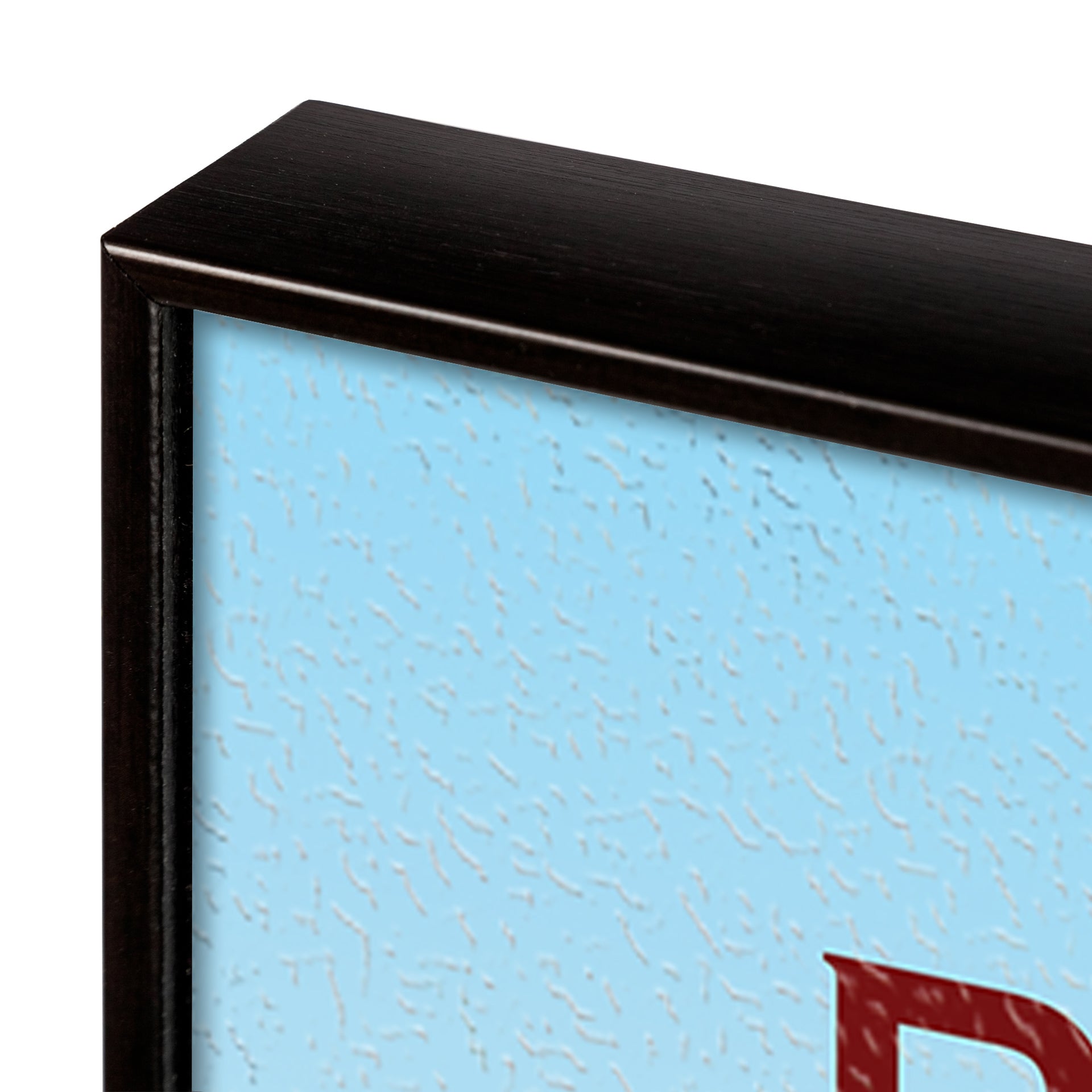 Close-up of a black frame corner with a textured blue background