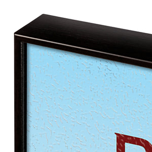 Close-up of a black frame corner with a textured blue background
