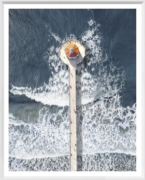 Manhattan Beach Pier wall art featuring an aerial view of the pier and ocean waves.