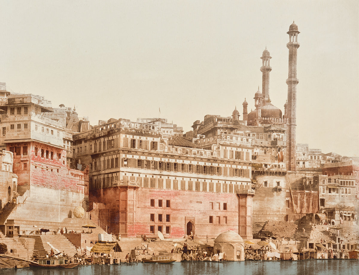 Benares, India 19th C, featuring historic buildings along the riverbank, with intricate architecture and minarets.