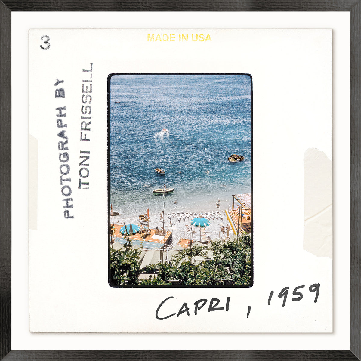 Toni Frissell Slides – Capri C. 1959, coastal view with boats and umbrellas, framed photograph