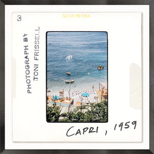 Toni Frissell Slides – Capri C. 1959, coastal view with boats and umbrellas, framed photograph