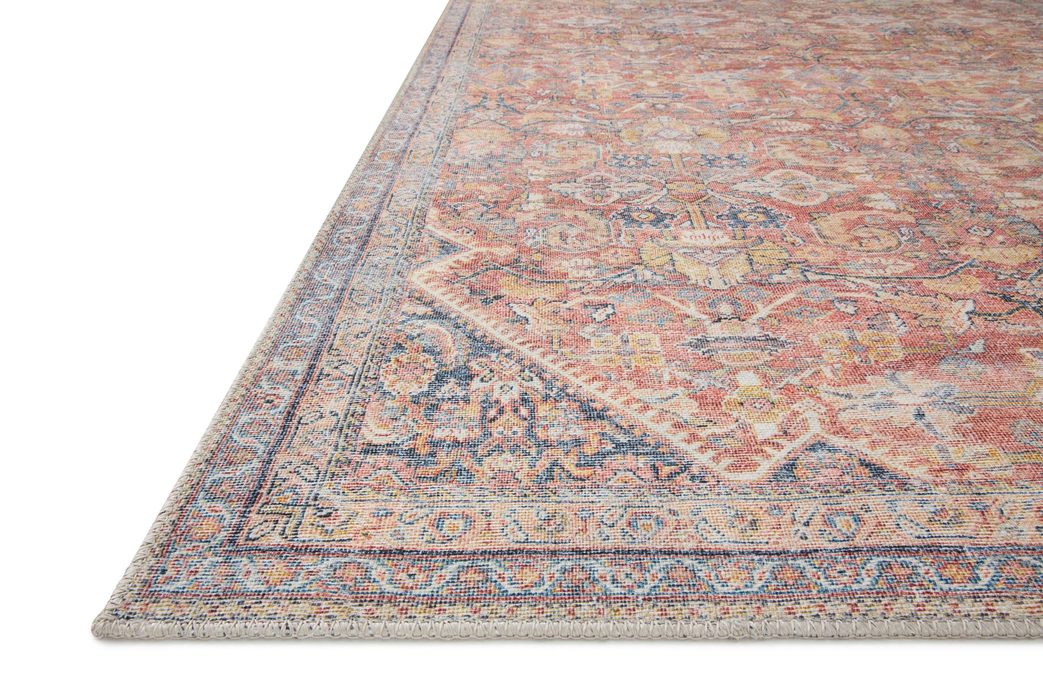 side view of Adrian Rust / Denim luxury Rug