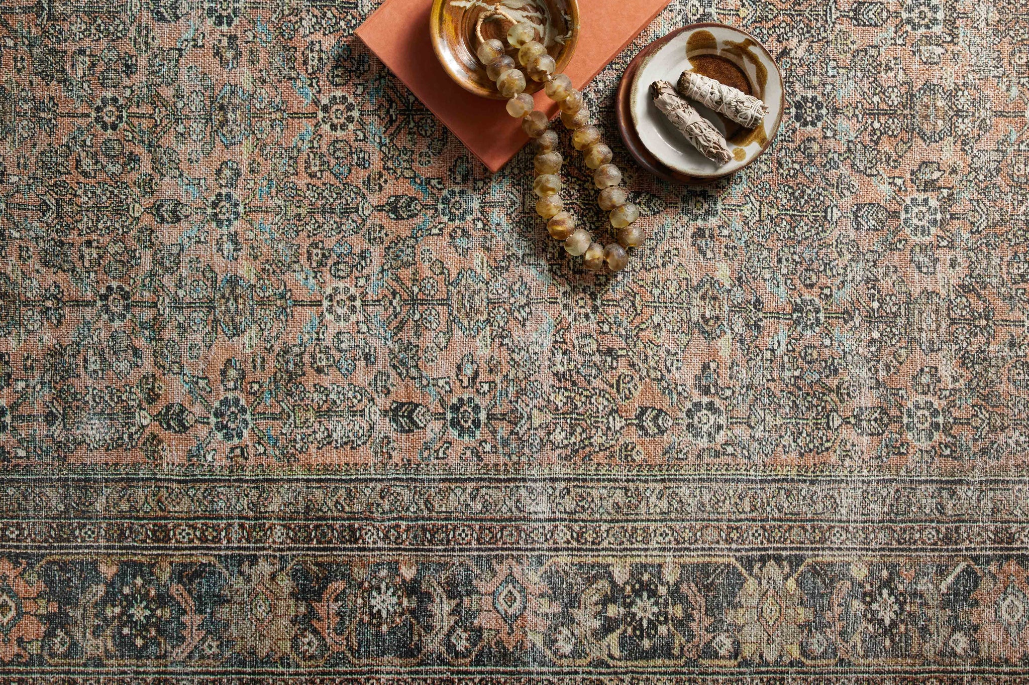 side view of Adrian Terracotta / Multi luxury Rug