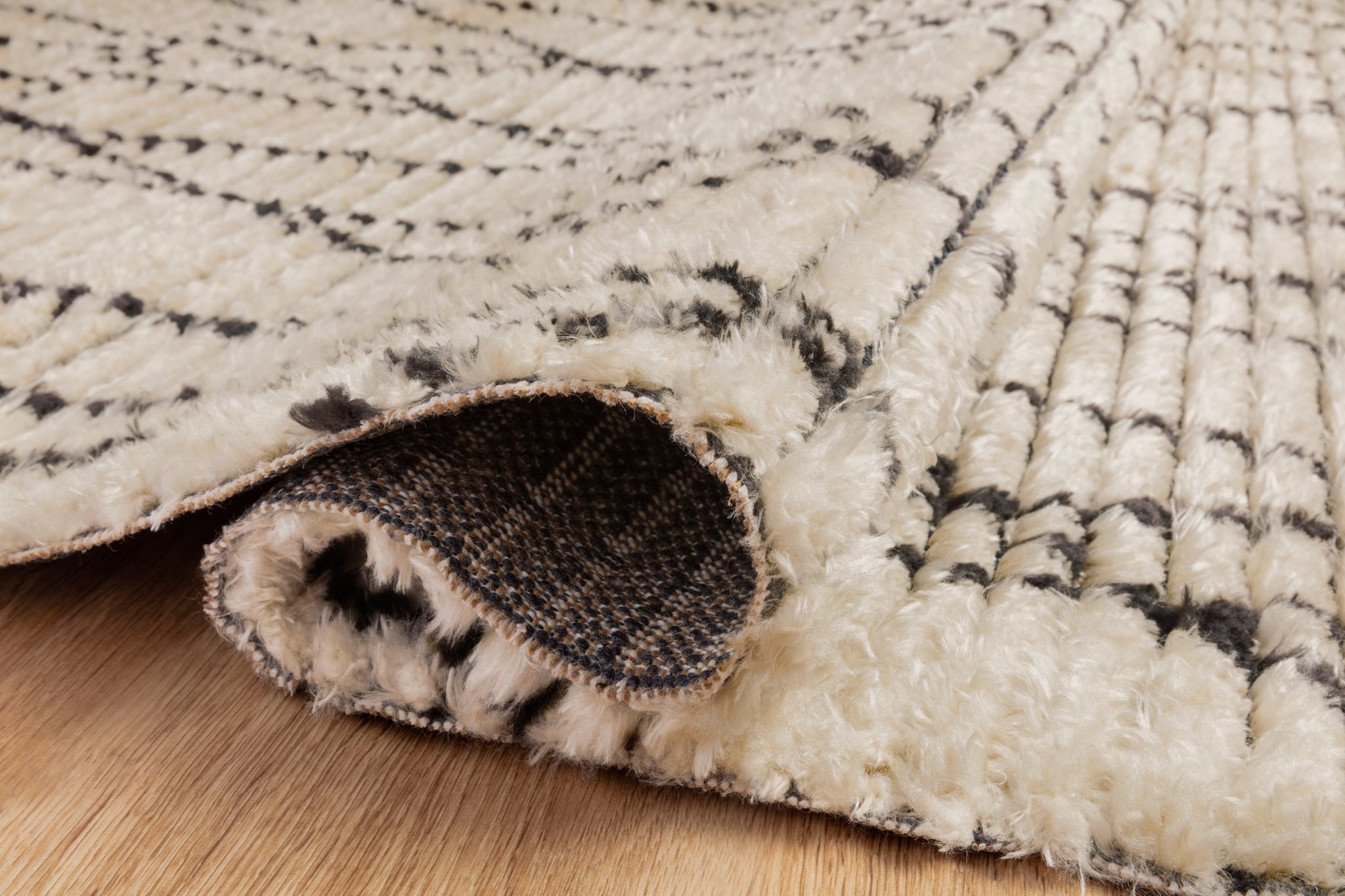 lifestyle view of Alice Cream / Charcoal by Chris Loves Julia x Loloi luxury Rug
