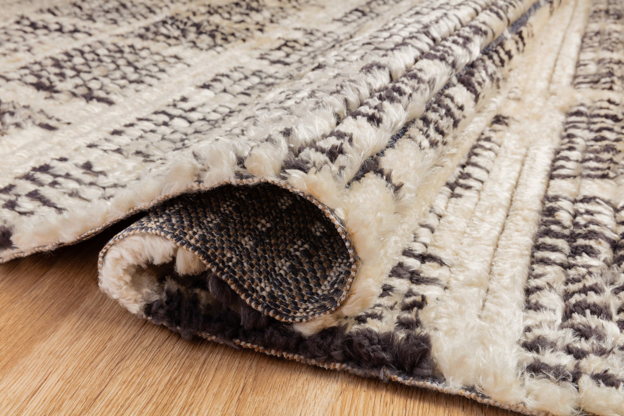 lifestyle view of Alice Cream / Charcoal by Chris Loves Julia x Loloi luxury Rug