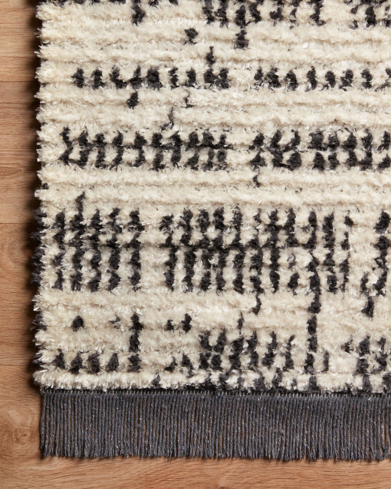 lifestyle view of Alice Cream / Charcoal by Chris Loves Julia x Loloi luxury Rug