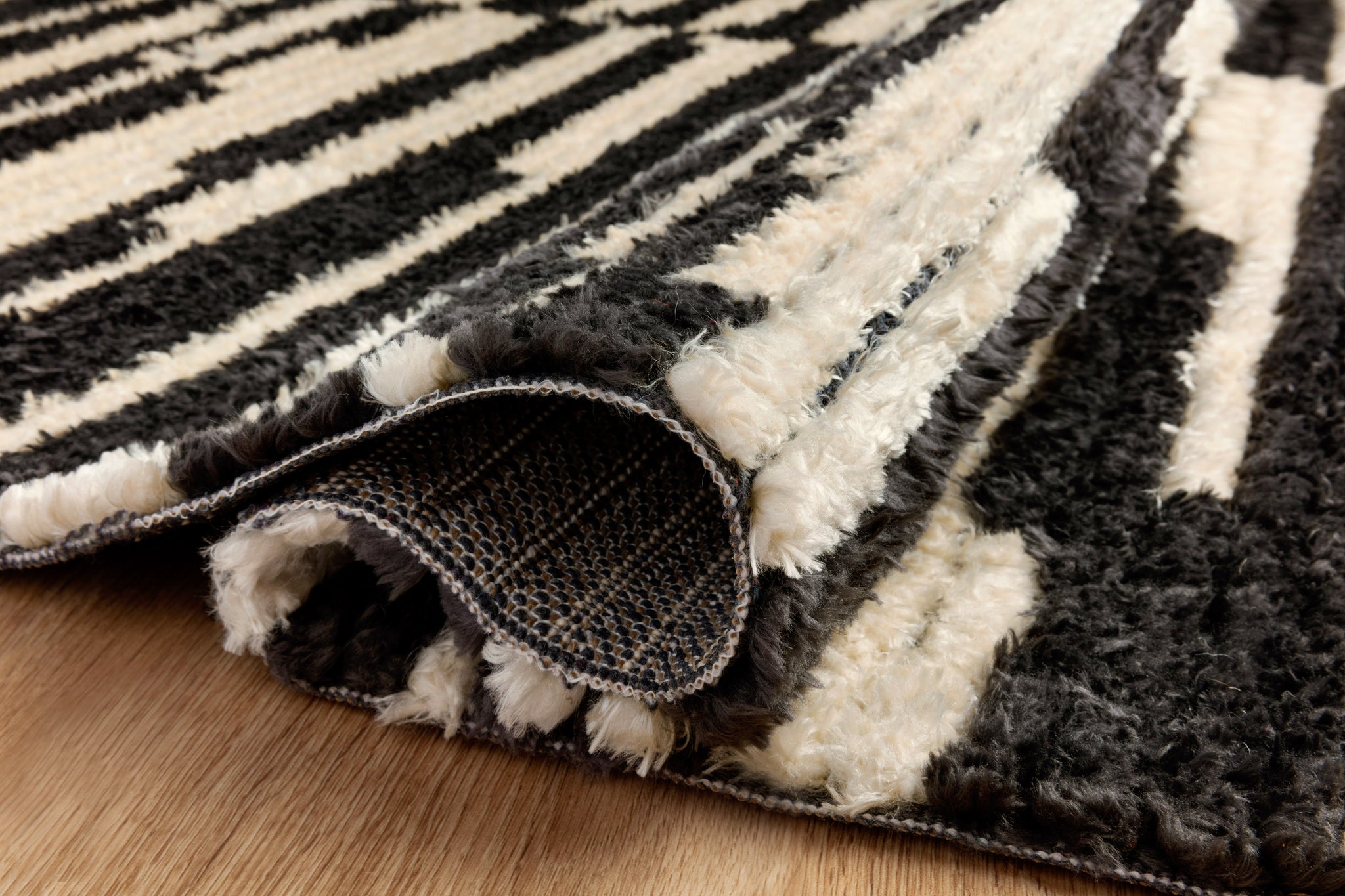 detail view of Alice Cream / Charcoal by Chris Loves Julia x Loloi luxury Rug