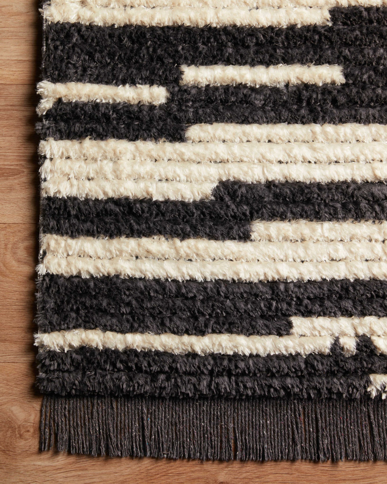 lifestyle view of Alice Cream / Charcoal by Chris Loves Julia x Loloi luxury Rug