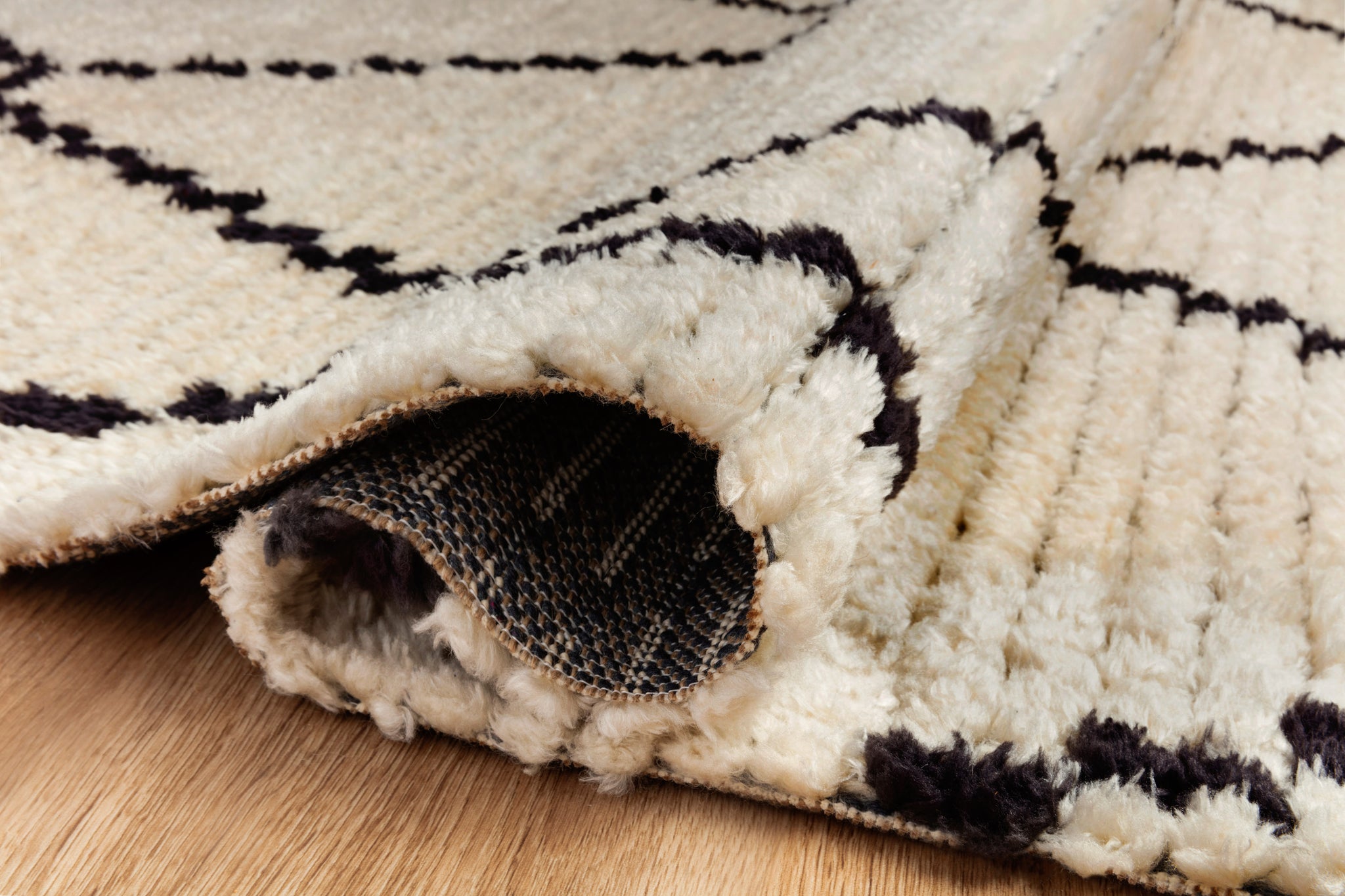 lifestyle view of Alice Cream / Charcoal by Chris Loves Julia x Loloi luxury Rug
