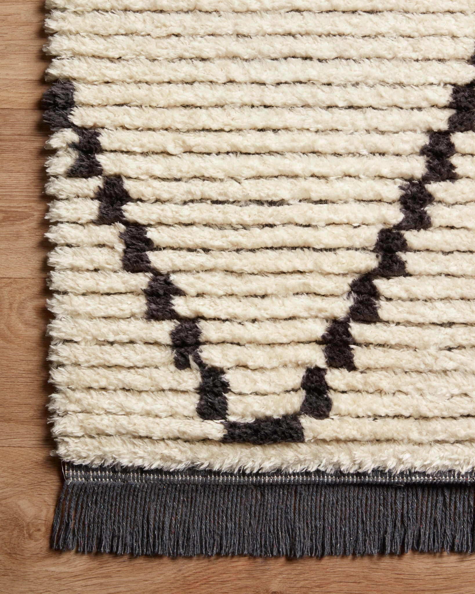 lifestyle view of Alice Cream / Charcoal by Chris Loves Julia x Loloi luxury Rug
