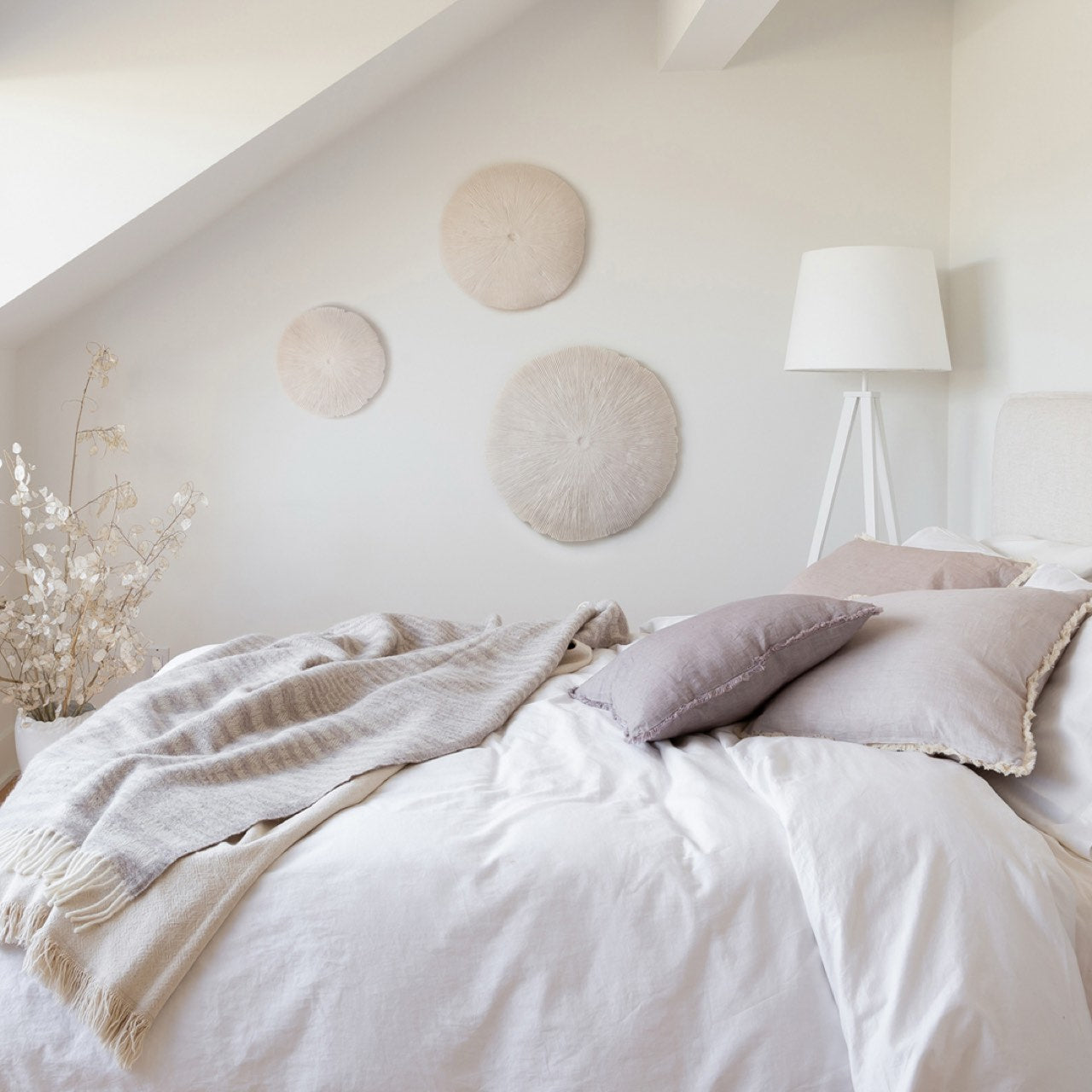 Round white cushion on a white background