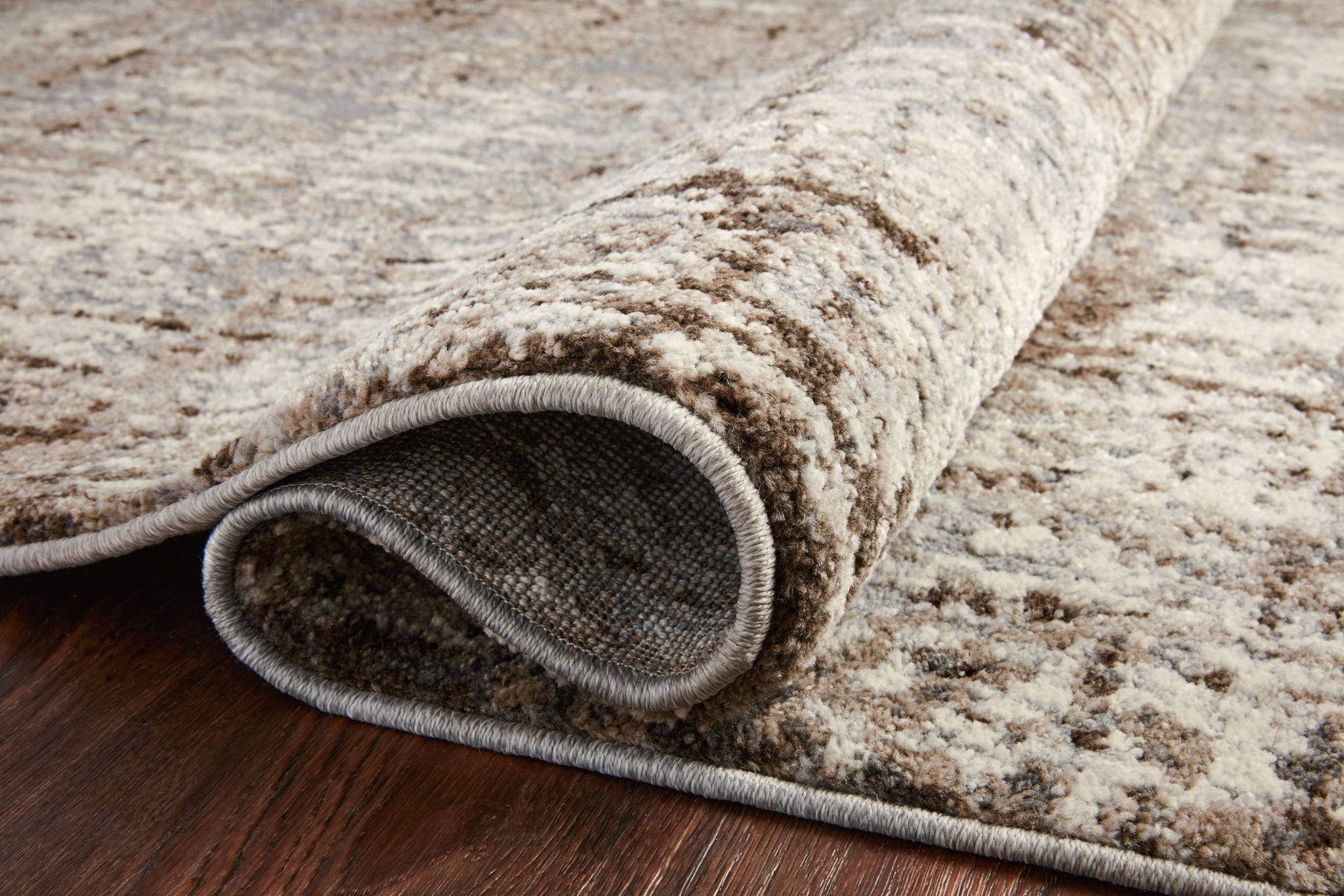 lifestyle view of Austen Natural / Mocha luxury Rug